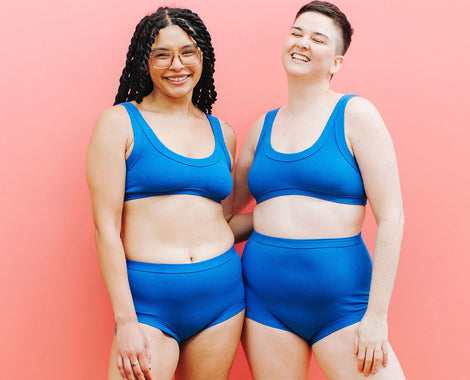Two models wearing sets of Thunderpants underwear and Bralettes in Blueberry Blue.