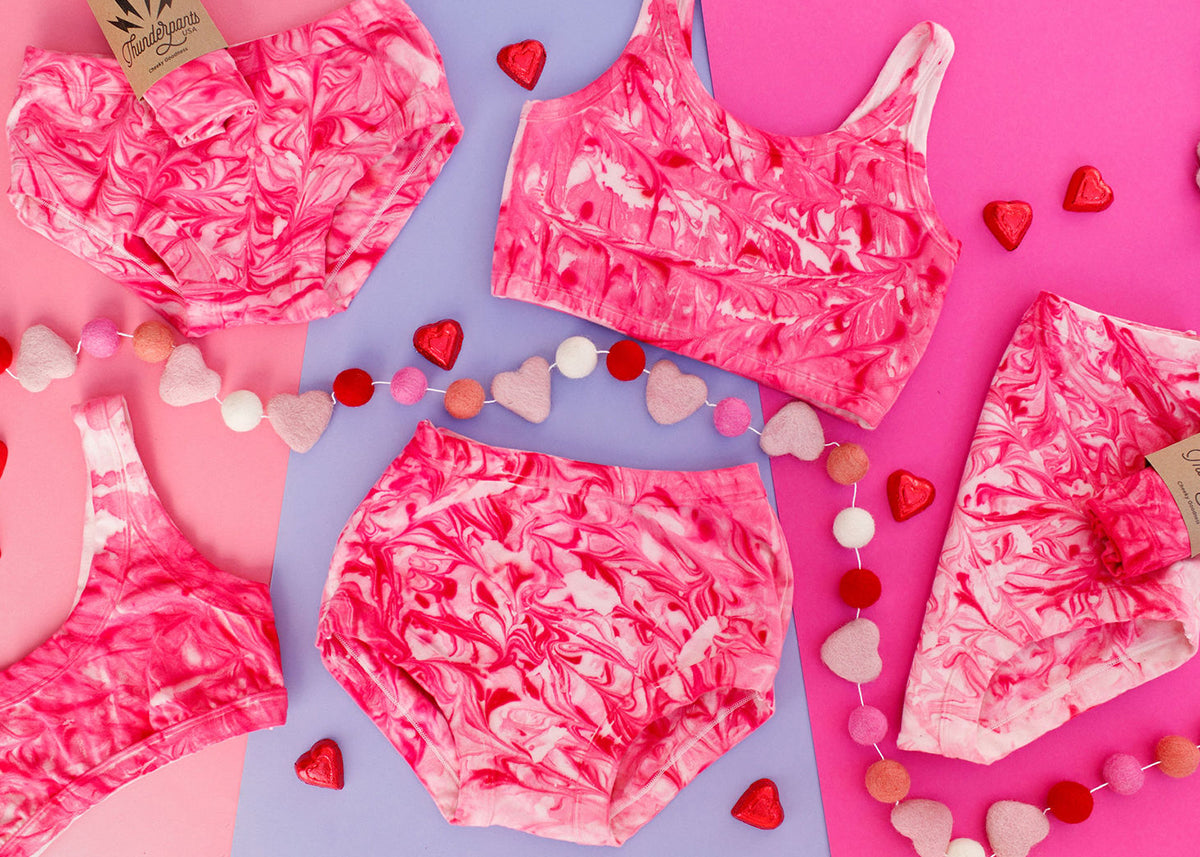 Various Thunderpants styles in pink marble dye.