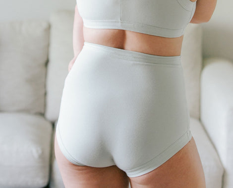 Model's bum wearing Thunderpants Sky Rise style underwear in Dried Sage color.