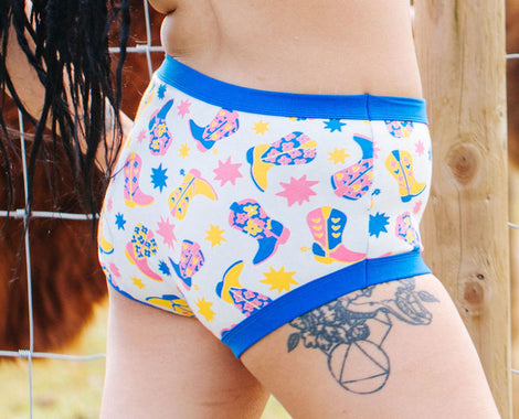 Close up of model wearing Thunderpants Original style underwear in Daisy Days print.