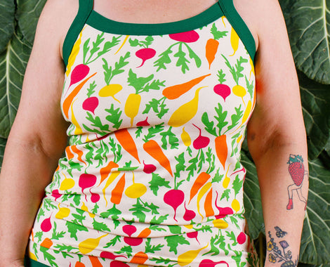 Close up of model wearing a Thunderpants Camisoles in the Root Veggies print.
