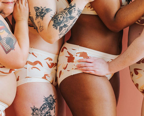 Close up of four models wearing various Thunderpants underwear styles in the Bodies in Motion print.