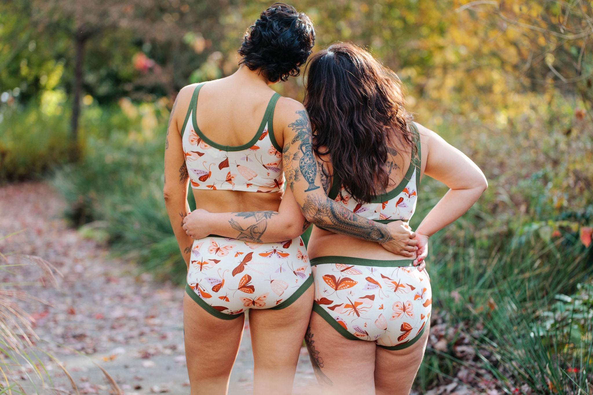 Two models wearing various items in Field Study - moths print.