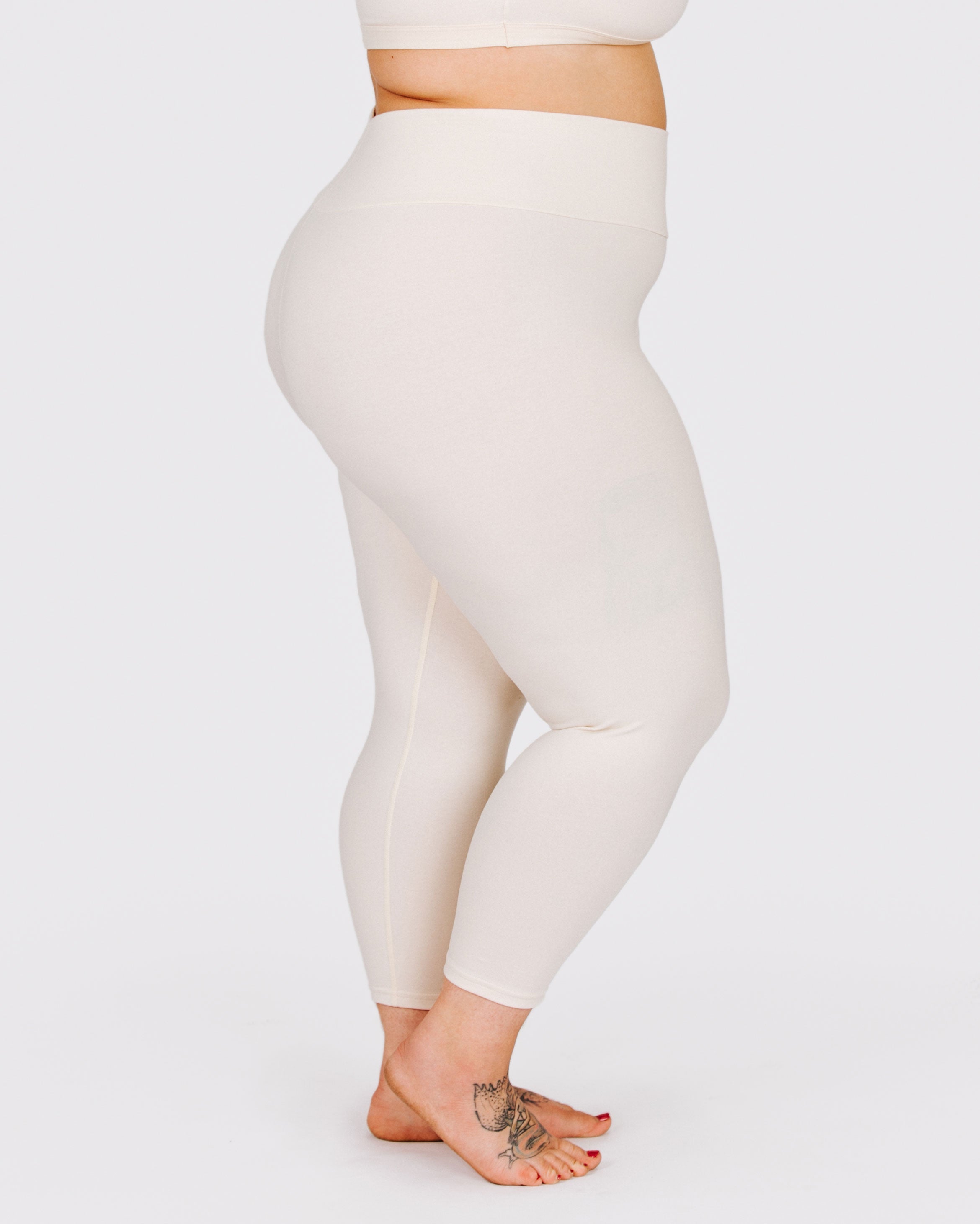 Fit photo from the side of Thunderpants organic cotton 3/4 Length Leggings in off-white on a model.
