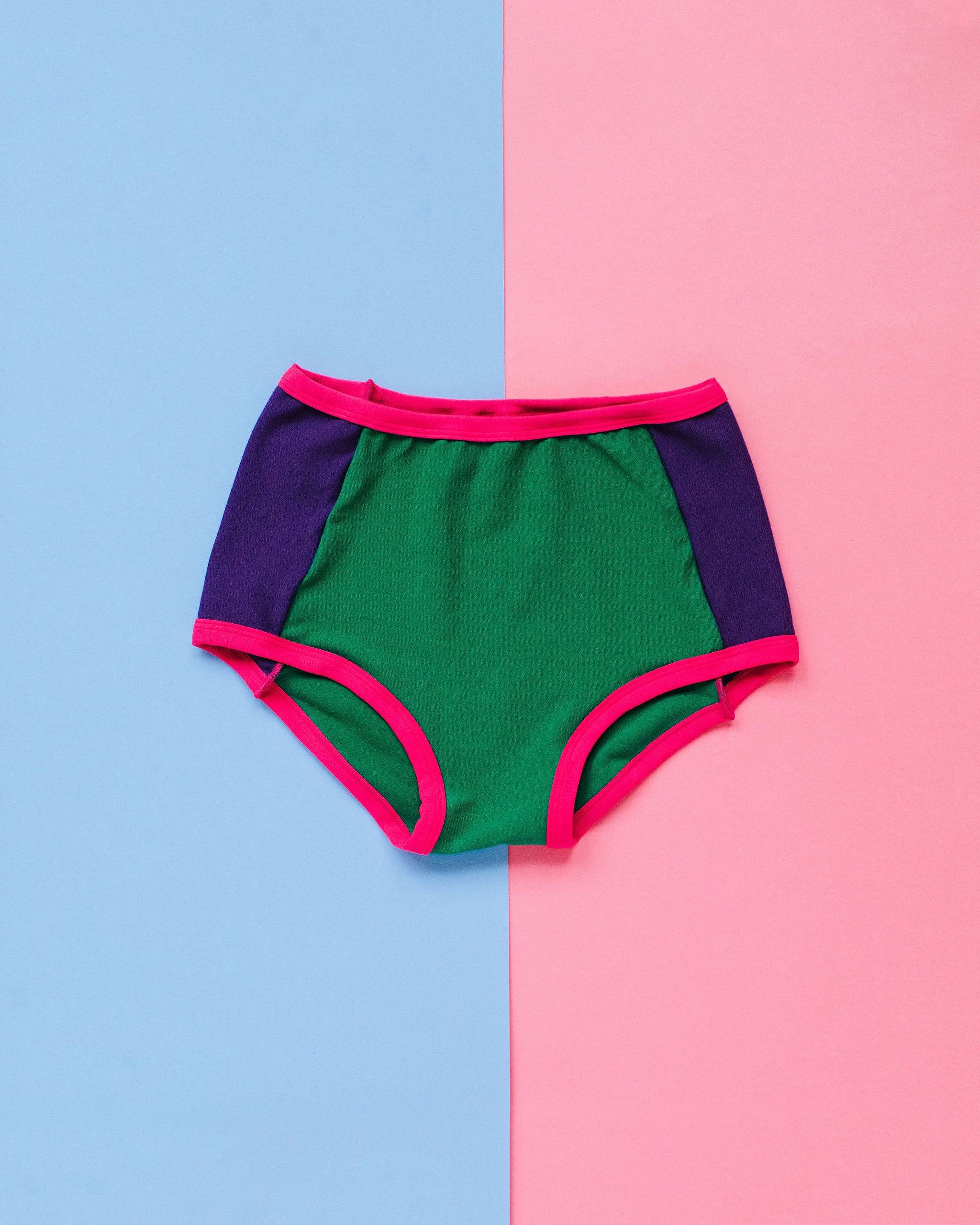 Flat lay of Thunderpants Original Panel Pants style underwear in 90's Dream - purple sides, green middle, and pink binding.