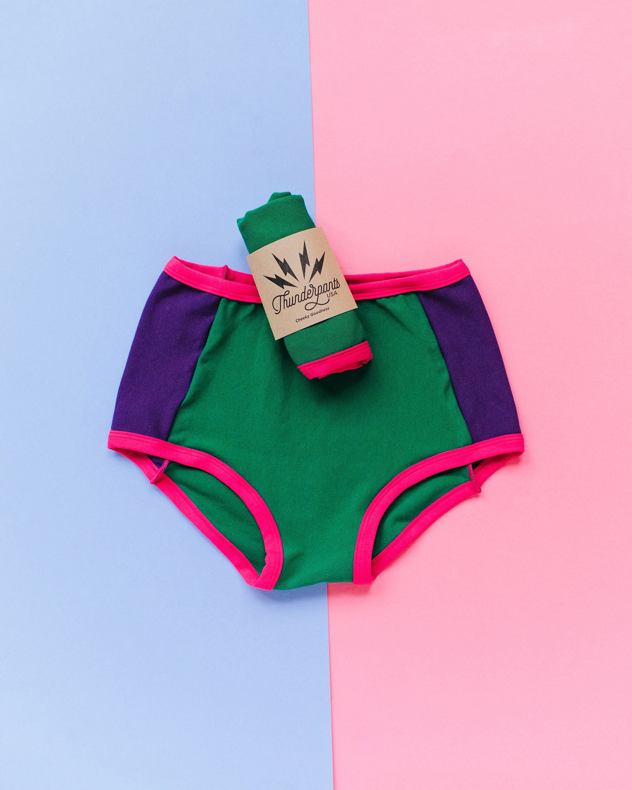 Flat lay of Thunderpants Original Panel Pants style underwear in 90's Dream - purple sides, green middle, and pink binding.