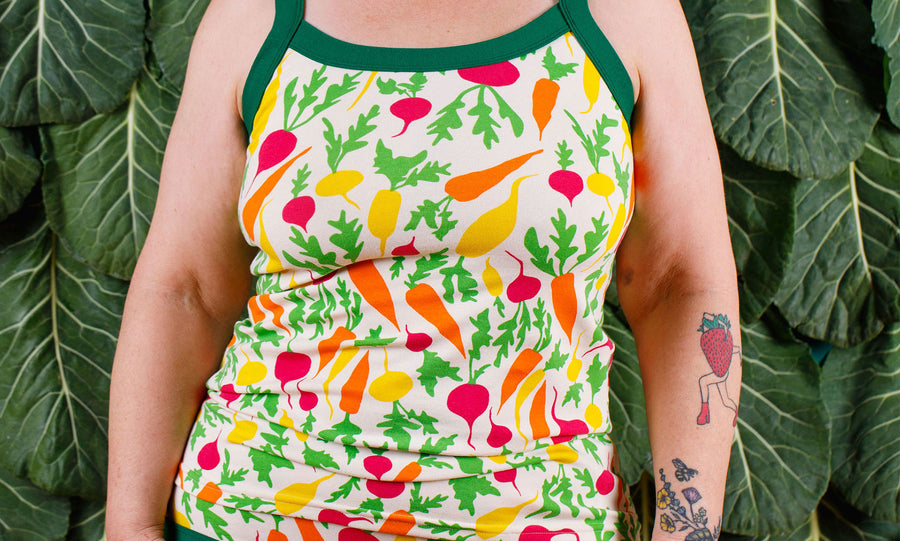 Close up of model wearing a Thunderpants Camisoles in the Root Veggies print.