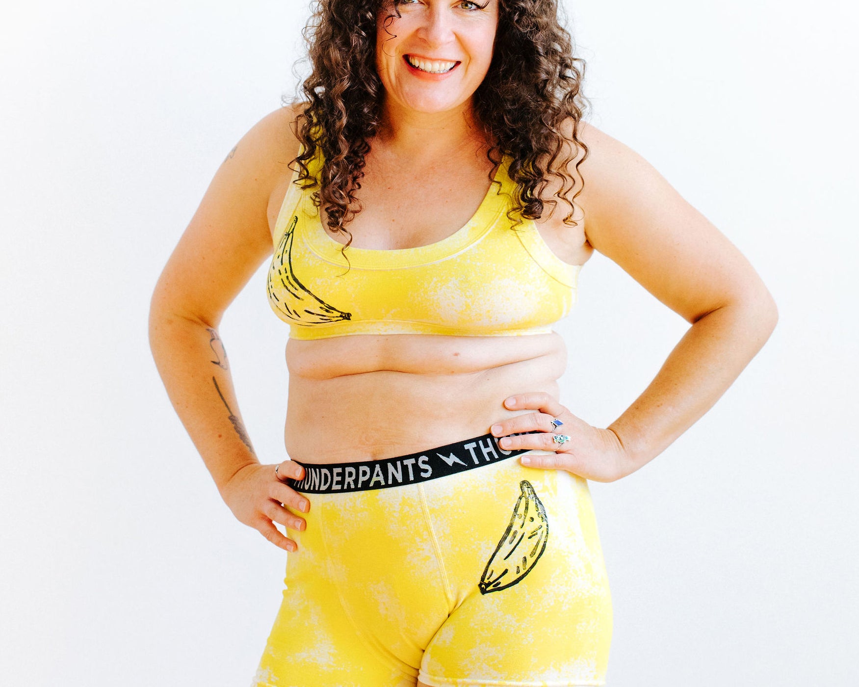 Model wearing Thunderpants Boxer Brief and Bralette in Banana Pitch - yellow with one black banana print.