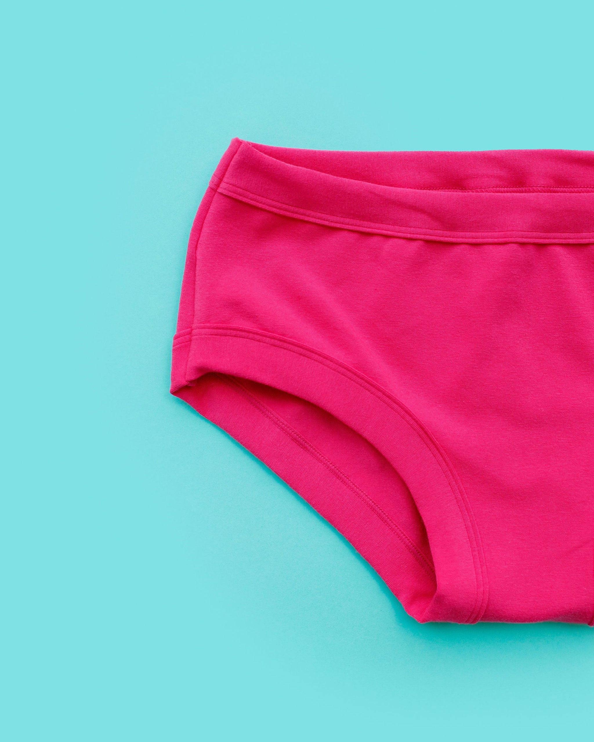Flat lay of Thunderpants Hipster style underwear in a hot pink color.