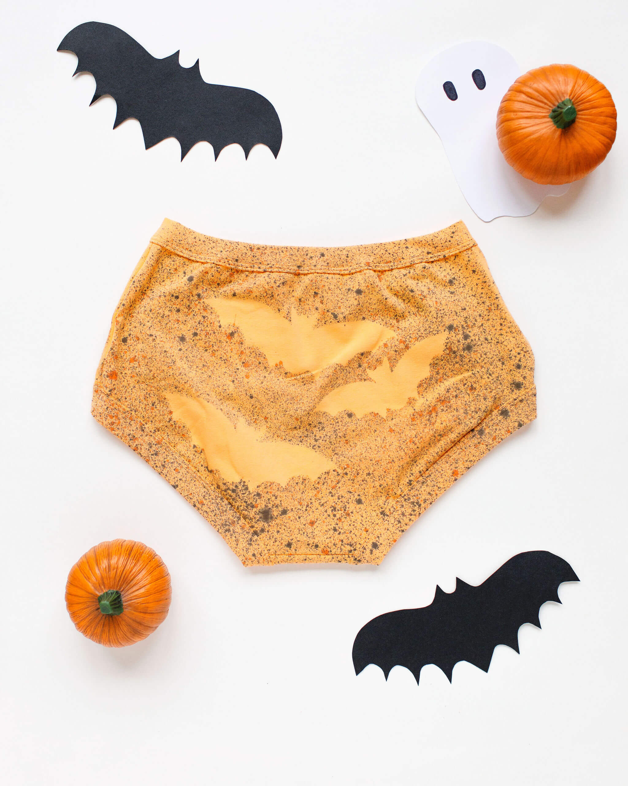 Flat lay of Thunderpants Original style underwear in Orange Sherbet with bat hand dye.