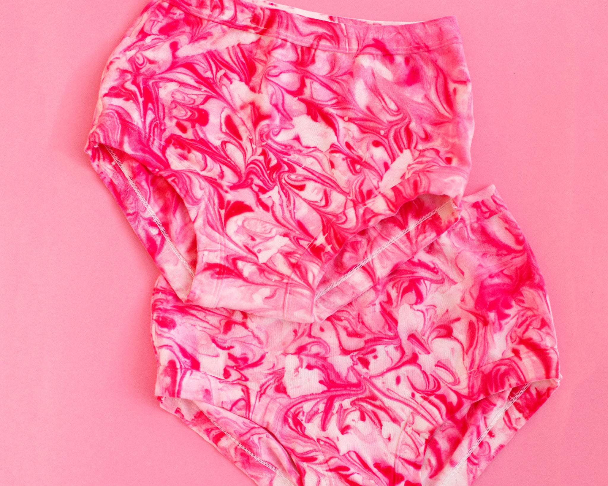 Two Thunderpants Original style underwear in pink marble dye.