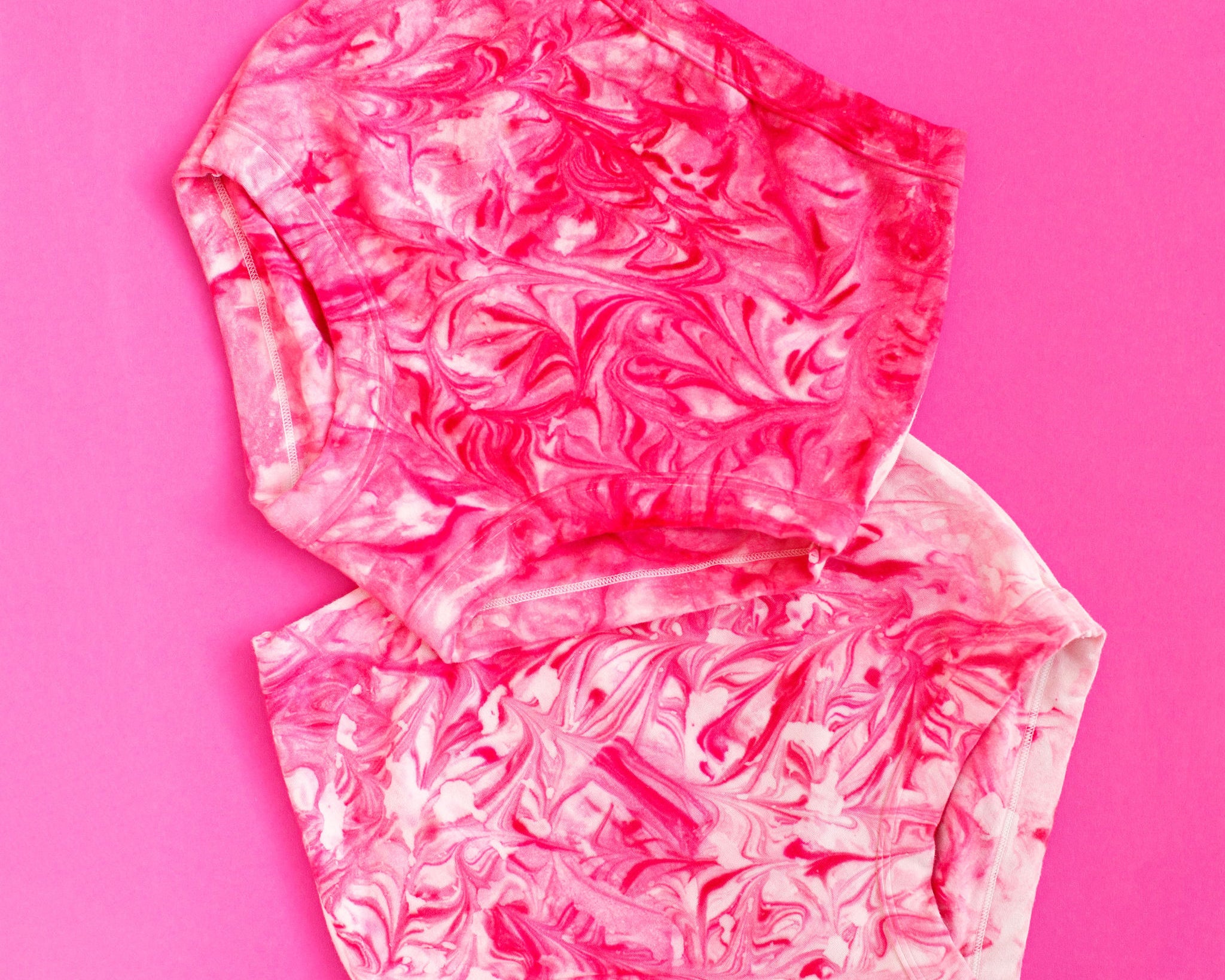 Two Thunderpants Sky Rise style underwear in pink marble dye.