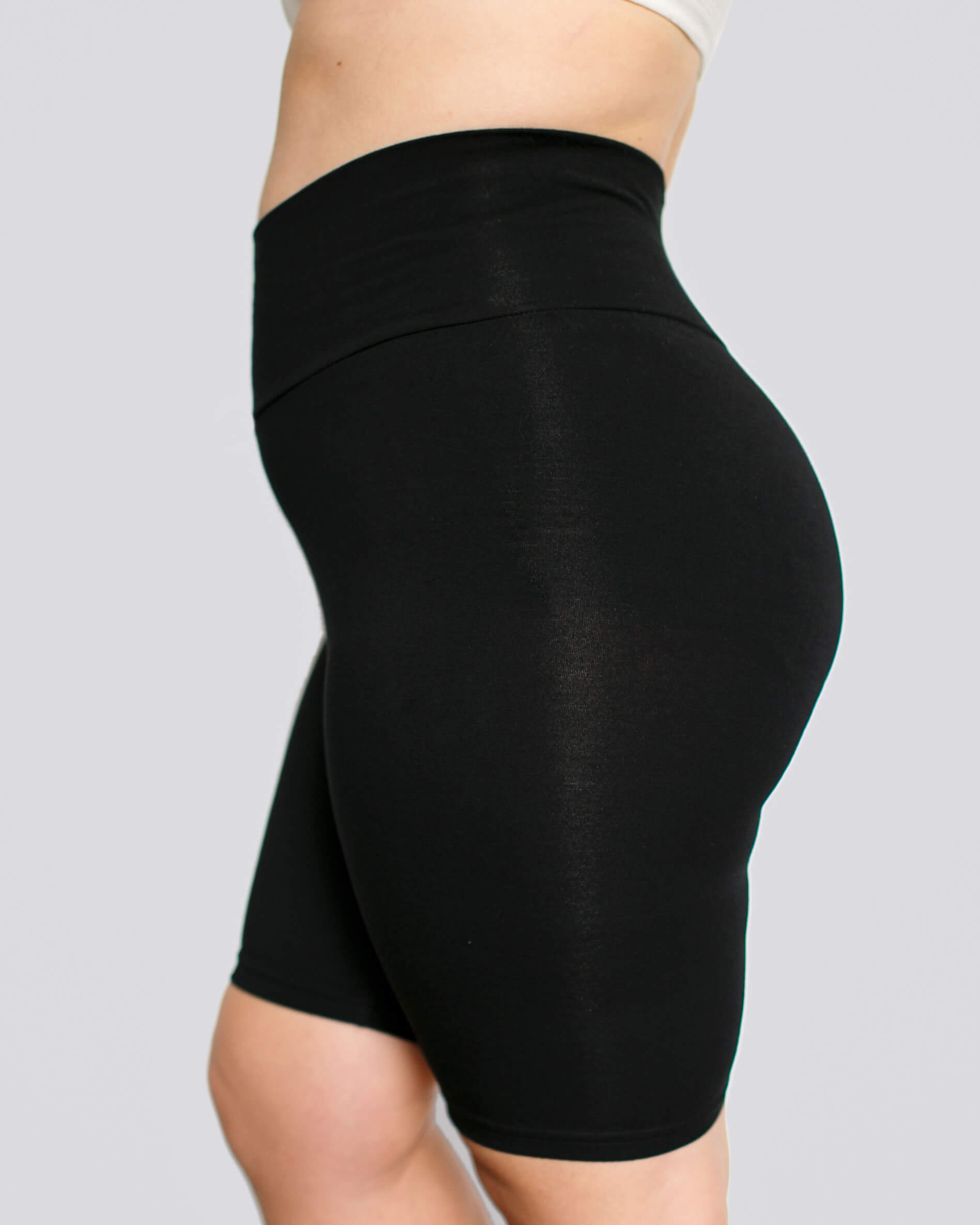 Close up of the side of a model wearing Thunderpants Bike Shorts in Plain Black.