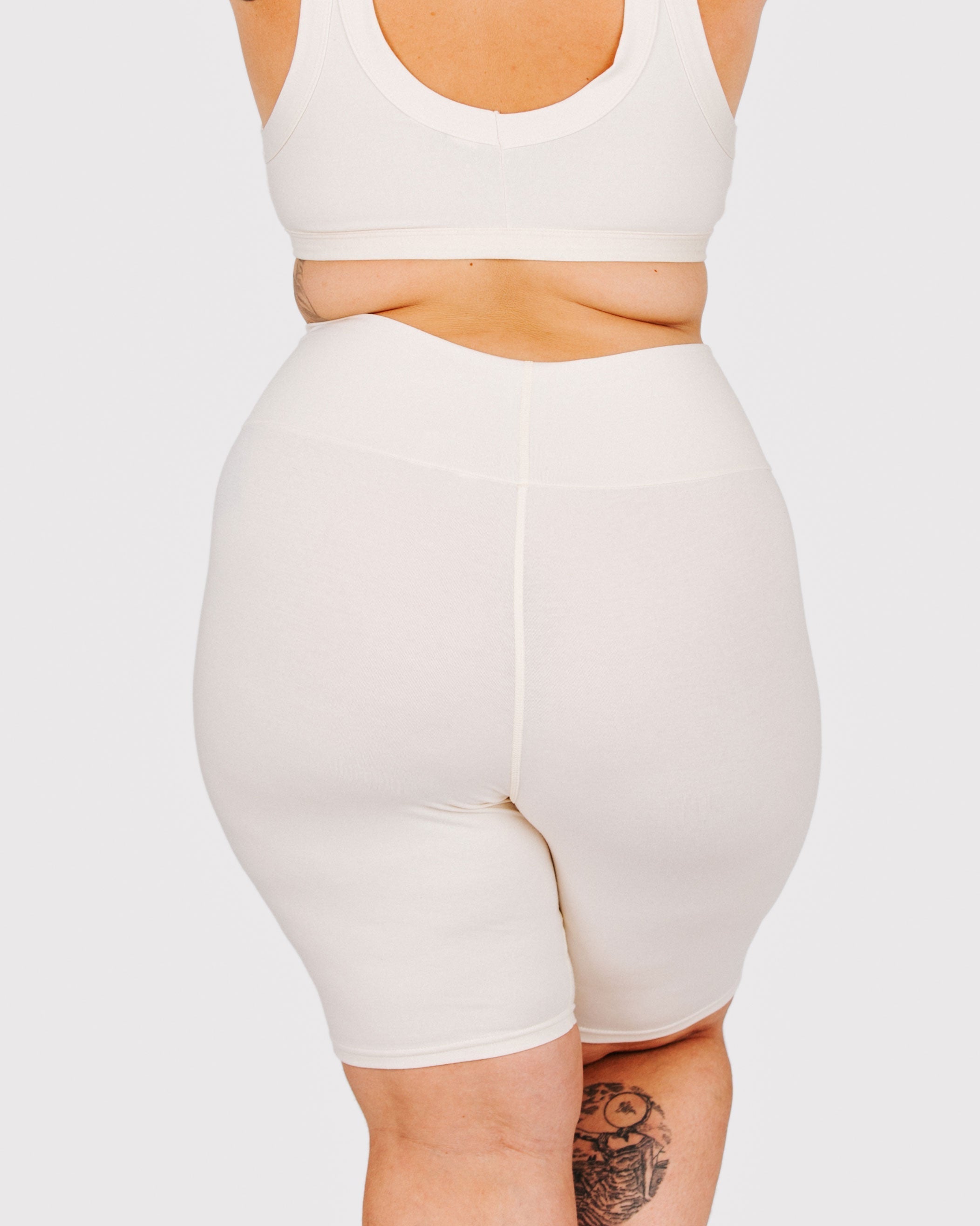 Fit photo from the back of Thunderpants organic cotton Bike Shorts in off-white on a model.