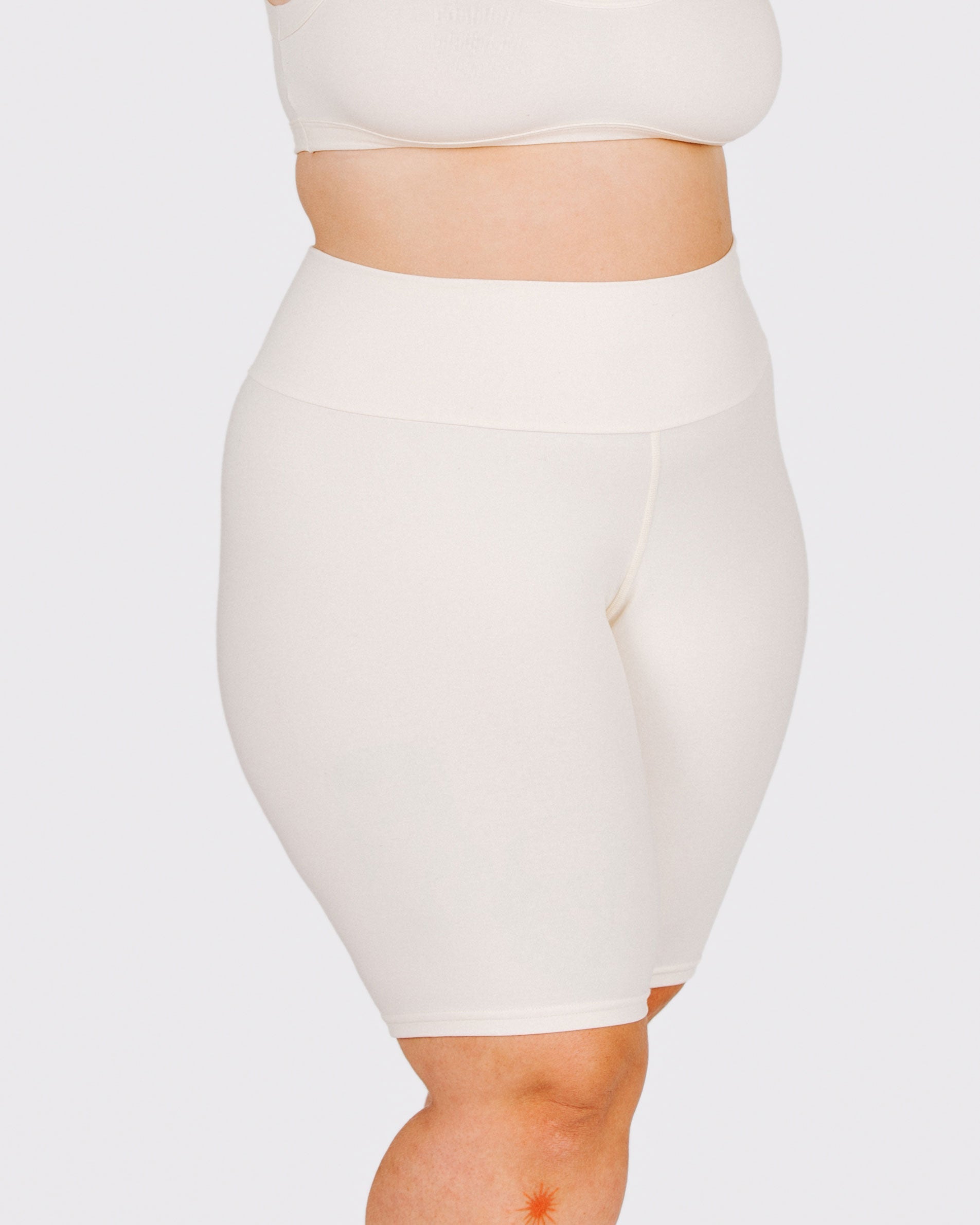 Fit photo from the front of Thunderpants organic cotton Bike Shorts in off-white on a model.