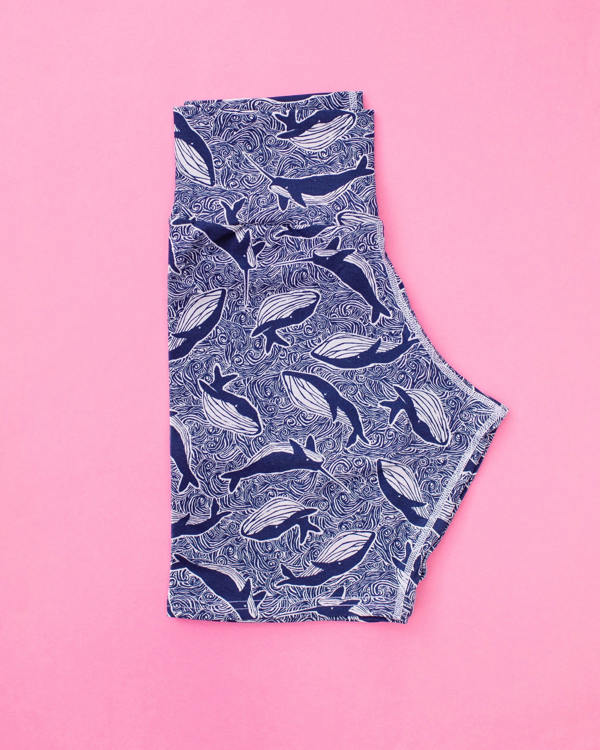 Flat lay of Thunderpants organic cotton Bike Shorts in whale print. 