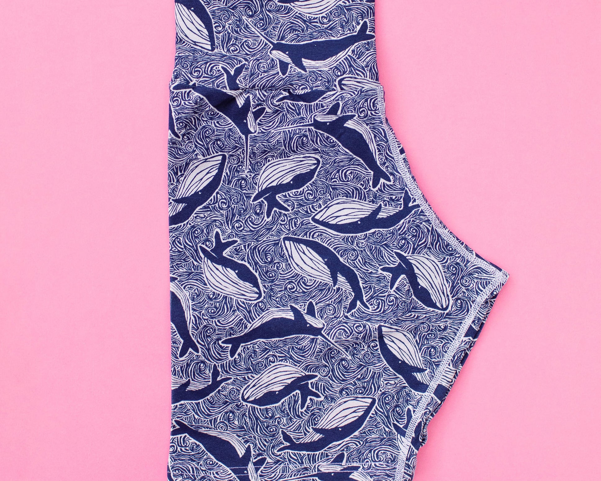 Flat lay of Thunderpants organic cotton Bike Shorts in whale print. 