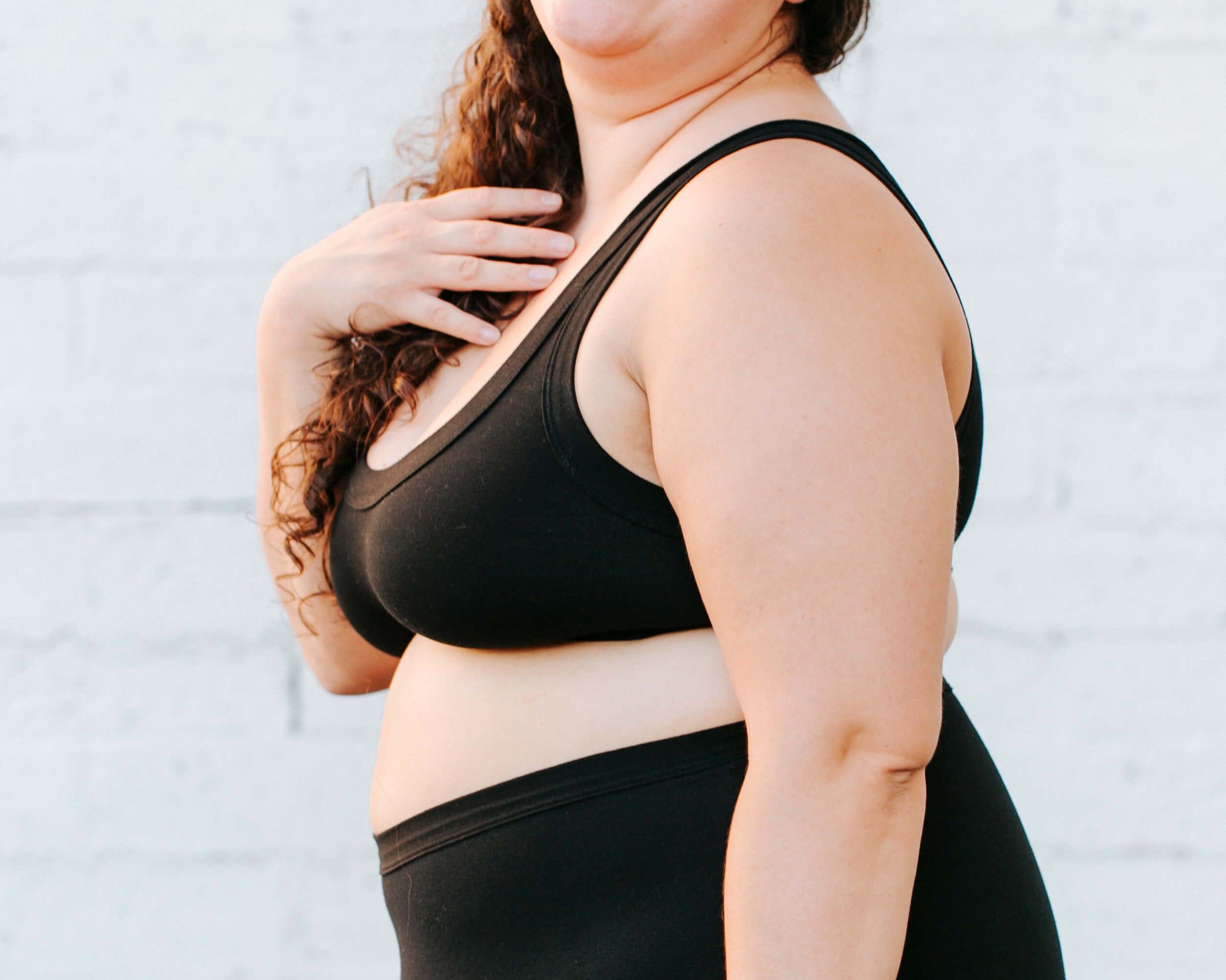 Close up of model wearing Thunderpants Original style underwear and Bralette in Plain Black.