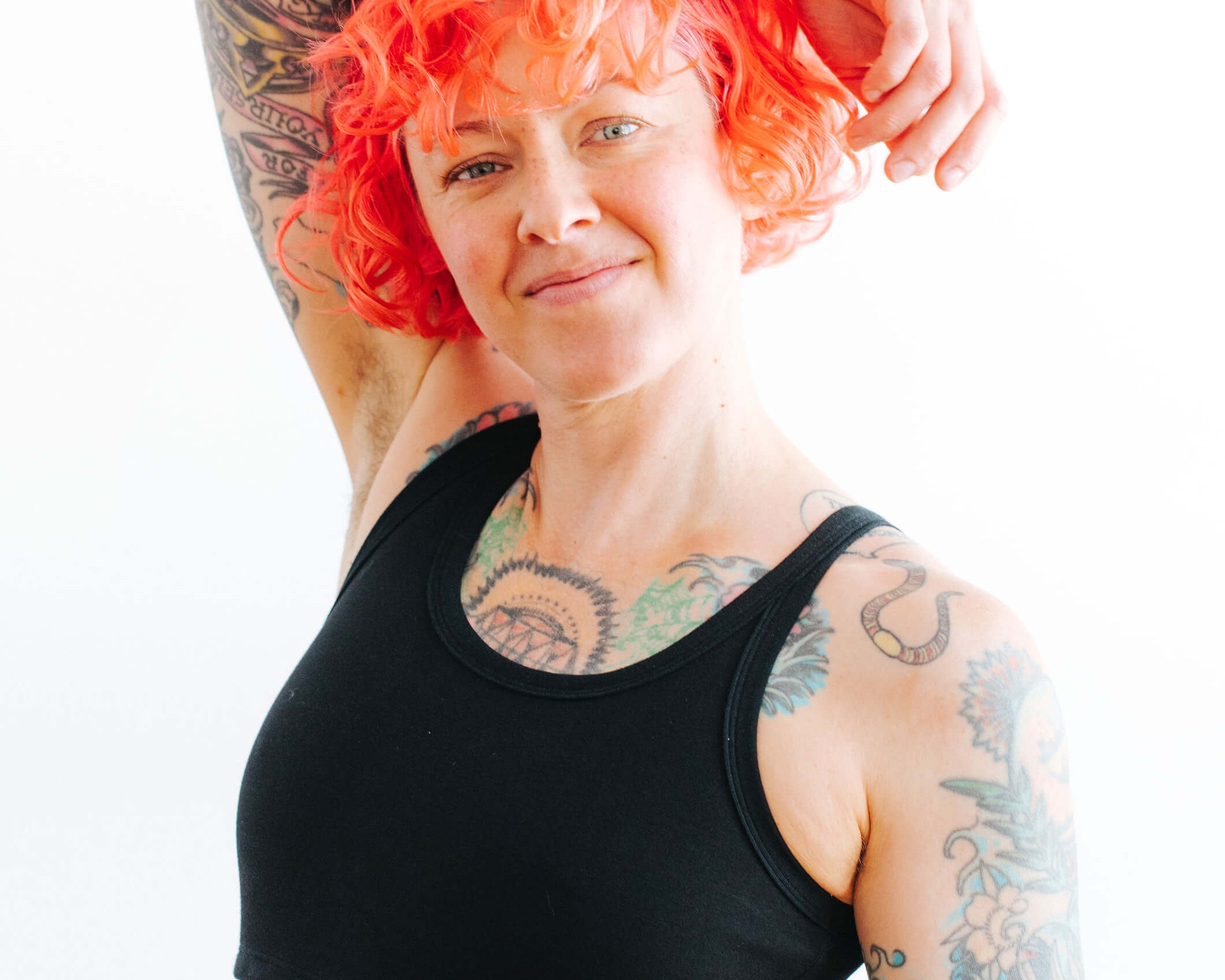 Close up of model wearing Thunderpants Longline Bra in Black.
