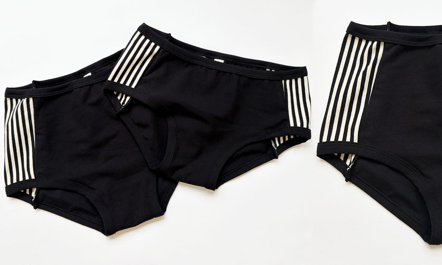 Flat lay of Thunderpants Original and Hipster Panel Pants style underwear in Black and White Stripe sides and Black fronts.