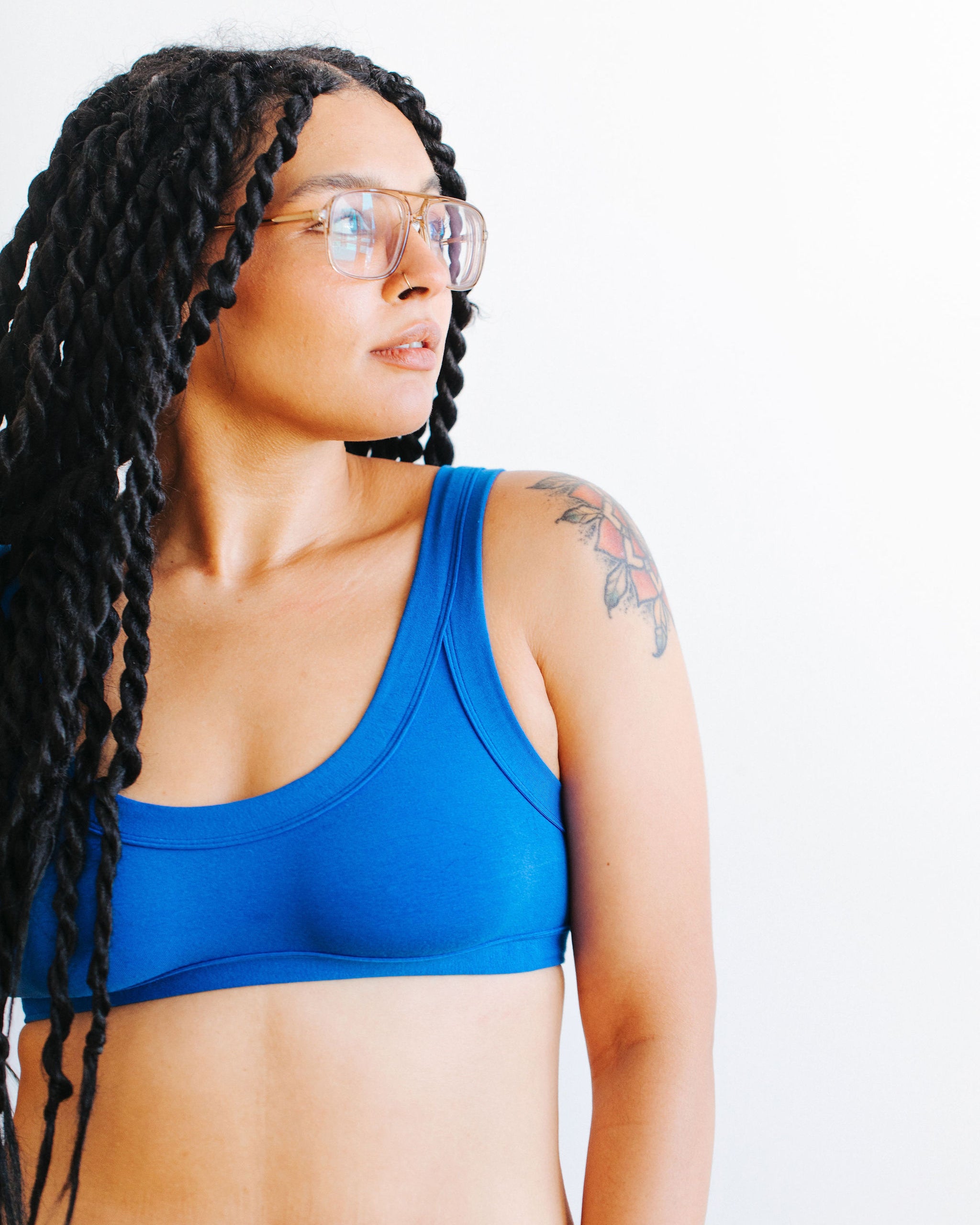 Close up of model wearing Thunderpants Bralette in Blueberry Blue.