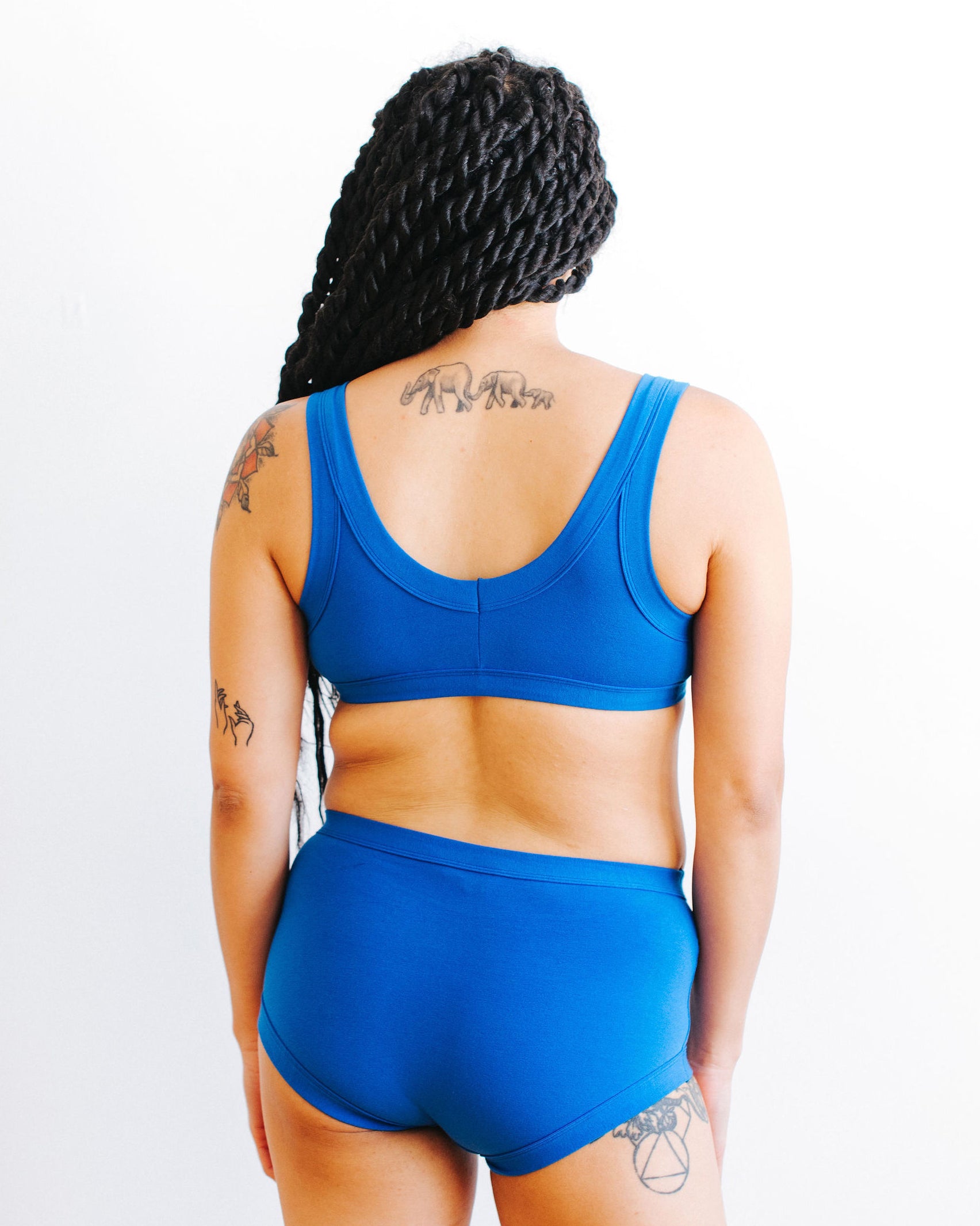 Back of model wearing Thunderpants Bralette and underwear set in Blueberry Blue.