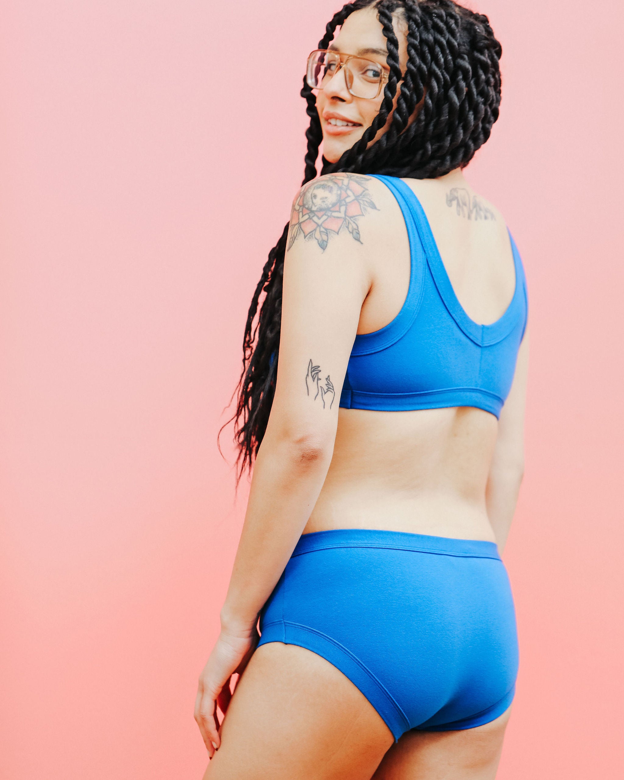 Close up of model wearing Thunderpants Hipster style underwear and Bralette in Blueberry Blue.