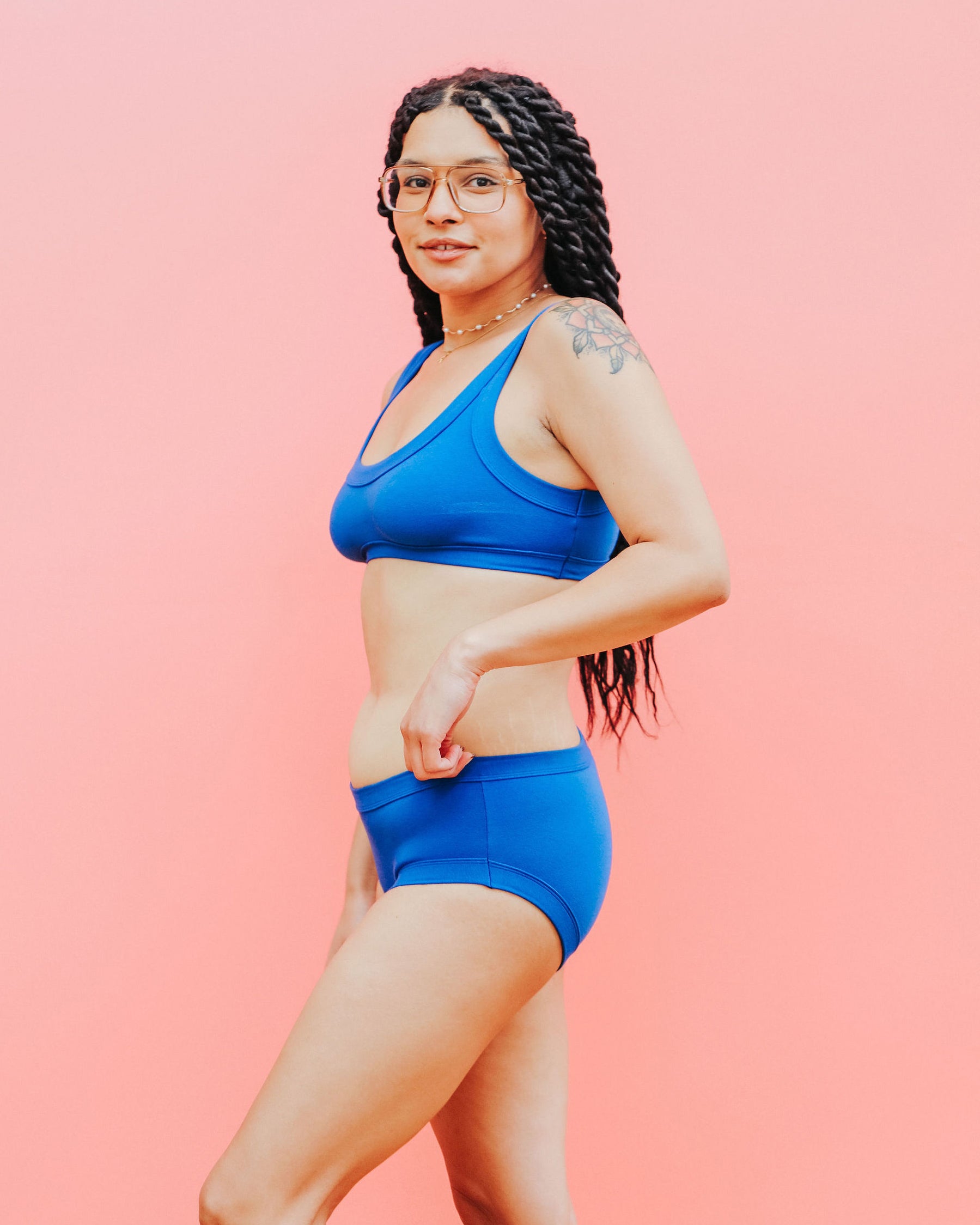 Model wearing Thunderpants Hipster style underwear and Bralette set in Blueberry Blue.