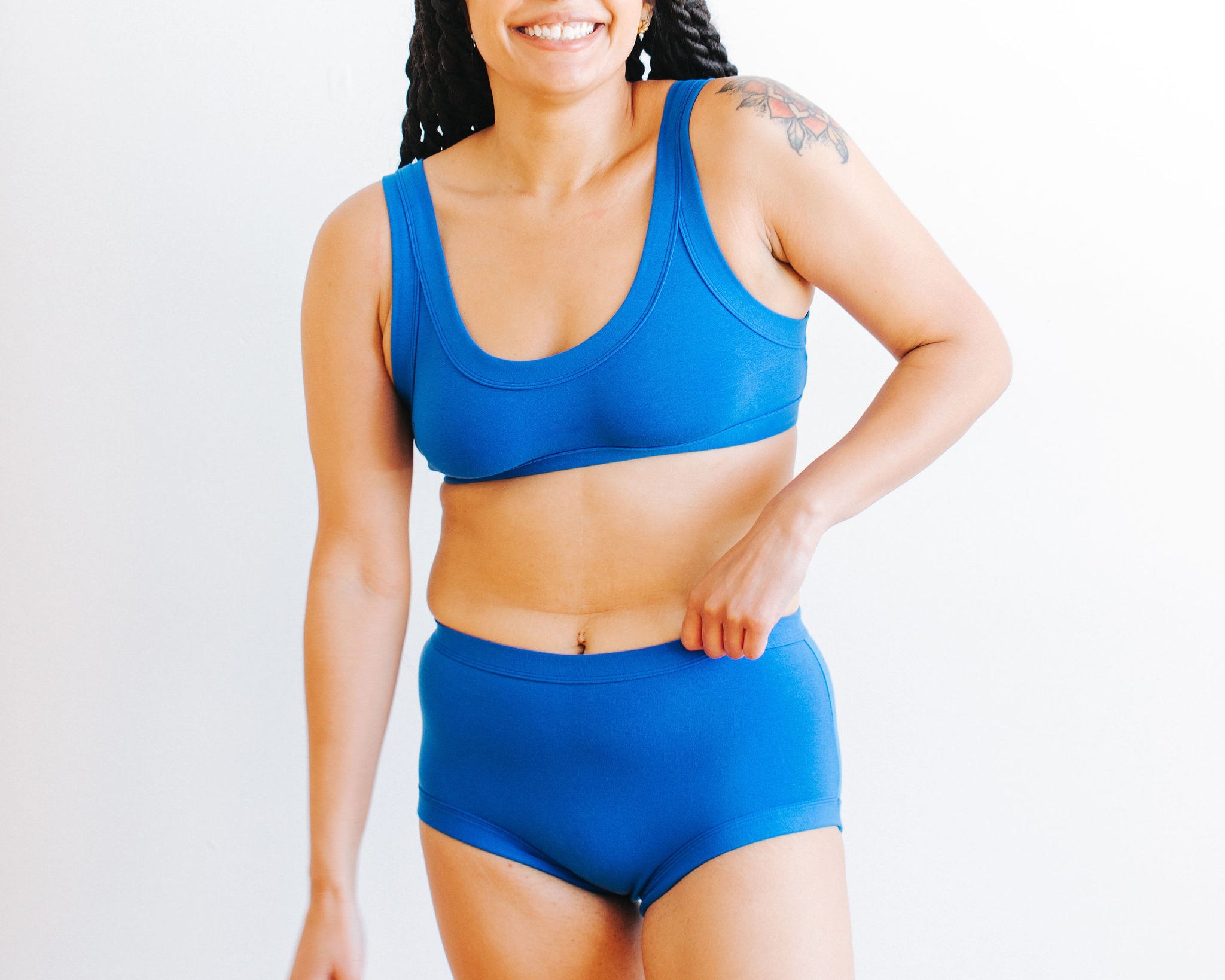 Model wearing Thunderpants Original style underwear and Bralette set in Blueberry Blue.