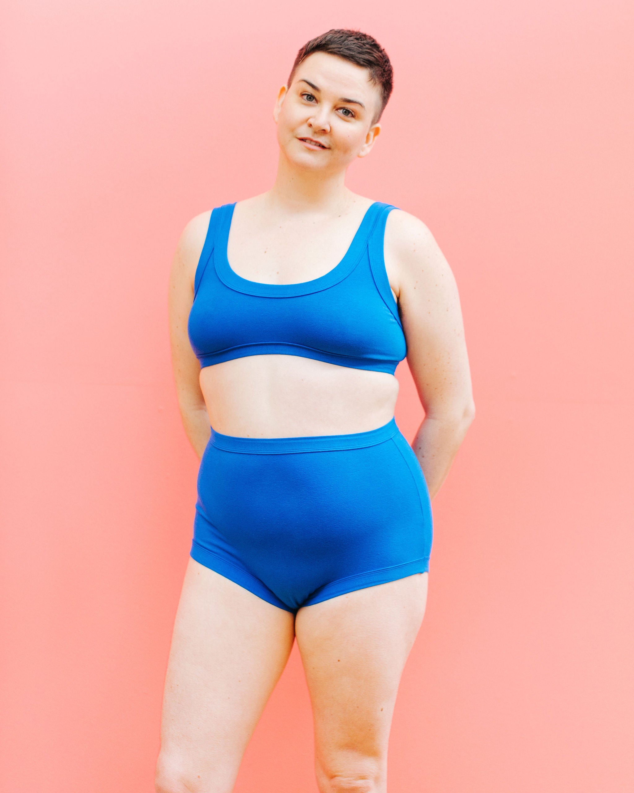 Model wearing Thunderpants Sky Rise style underwear and Bralette in Blueberry Blue.