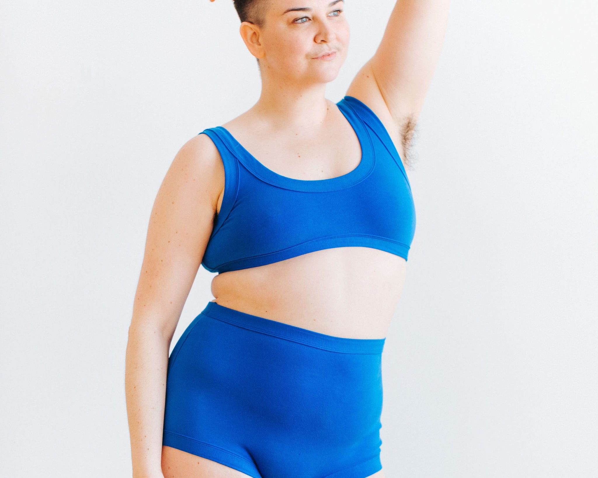 Model wearing Thunderpants Sky Rise style underwear and Bralette set in Blueberry Blue. 