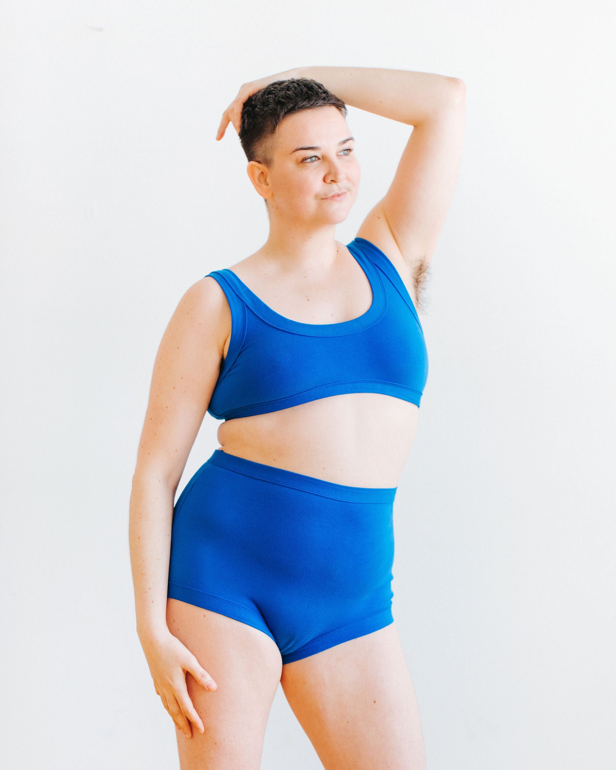 Model wearing Thunderpants Sky Rise style underwear and Bralette set in Blueberry Blue. 