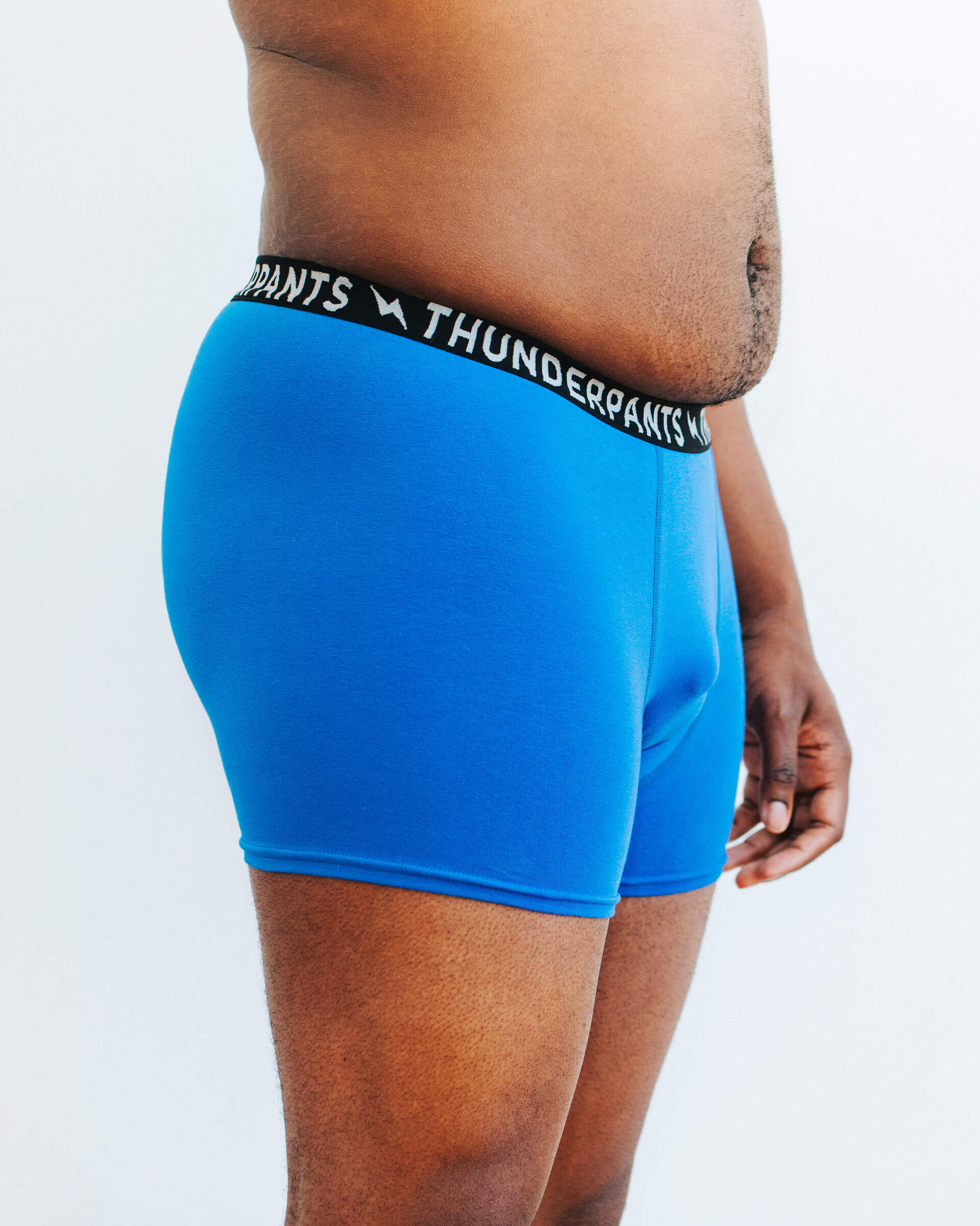 Side photo showing Thunderpants Organic Cotton Boxer Brief style underwear in Blueberry Blue on a model.