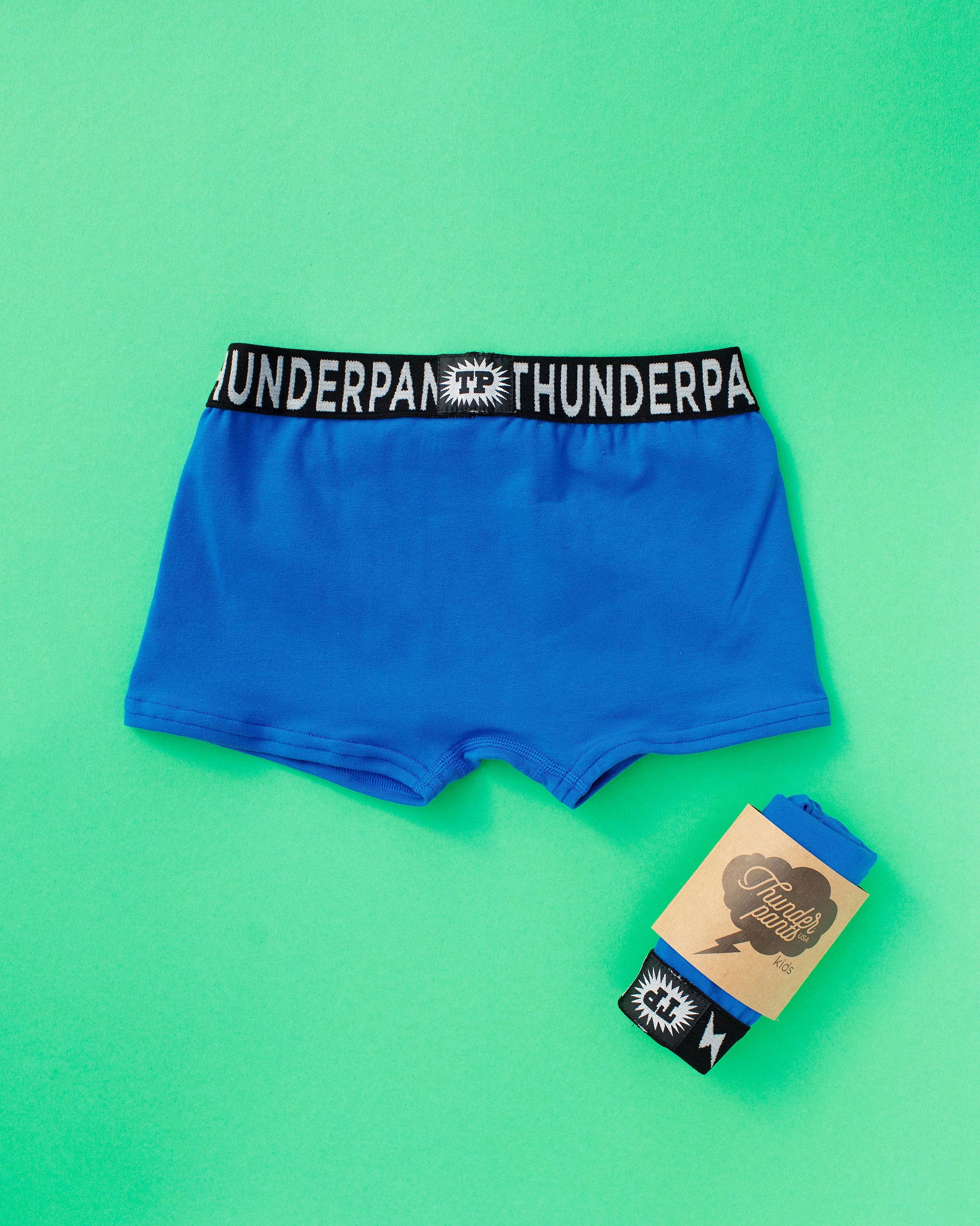 Flat lay of Thunderpants Kid's Boxer Brief style underwear in Blueberry Blue  print.