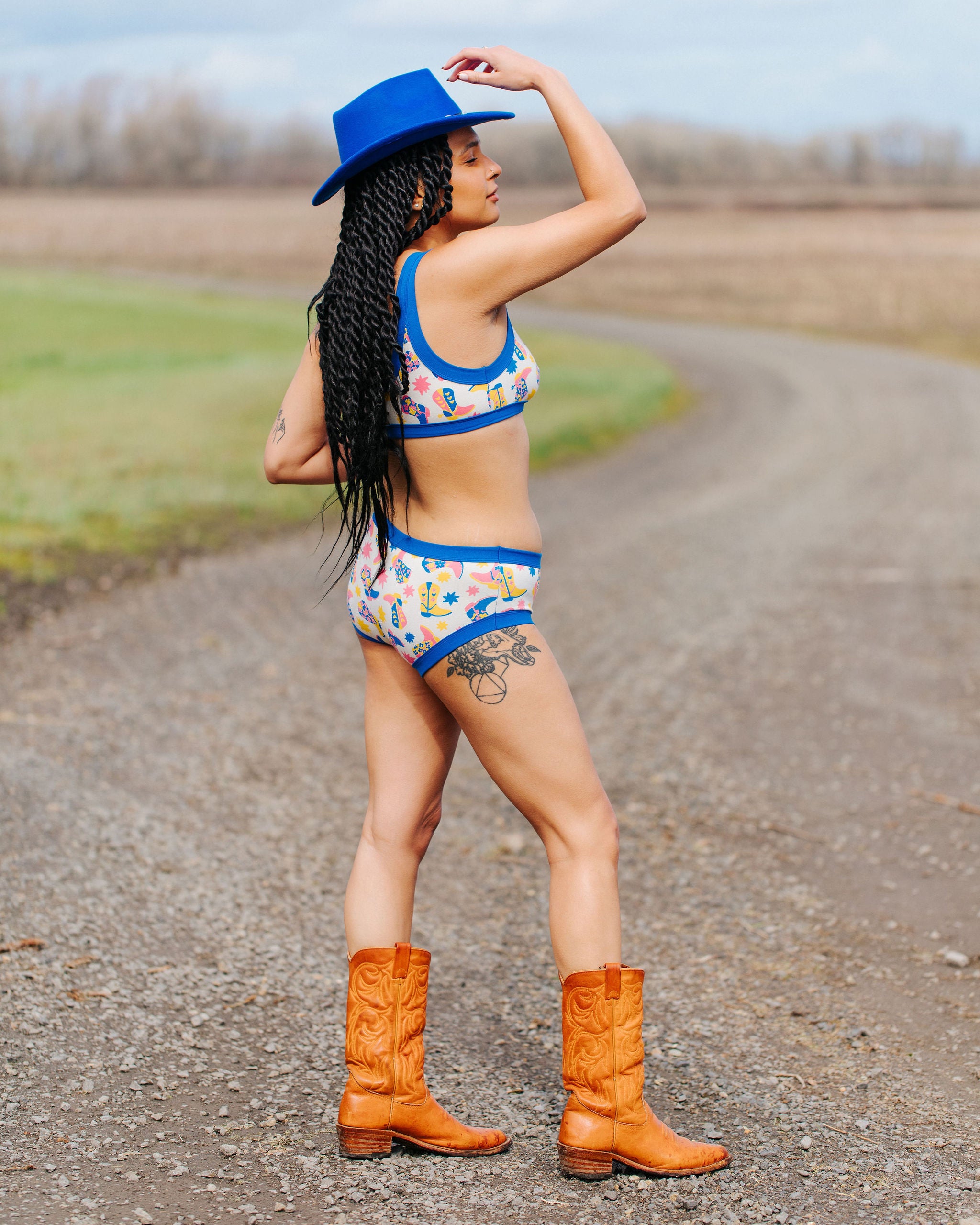Model wearing Thunderpants Hipster style underwear and Bralette in Boot Scootin' - fun boots in pink, yellow, and blue.