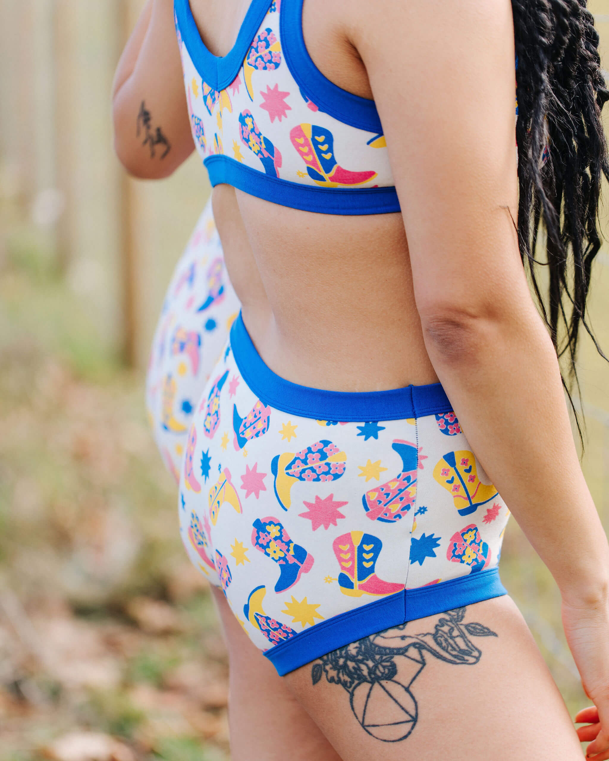 Close up of model wearing a set of Thunderpants Original style underwear and Bralette in Boot Scootin' print.