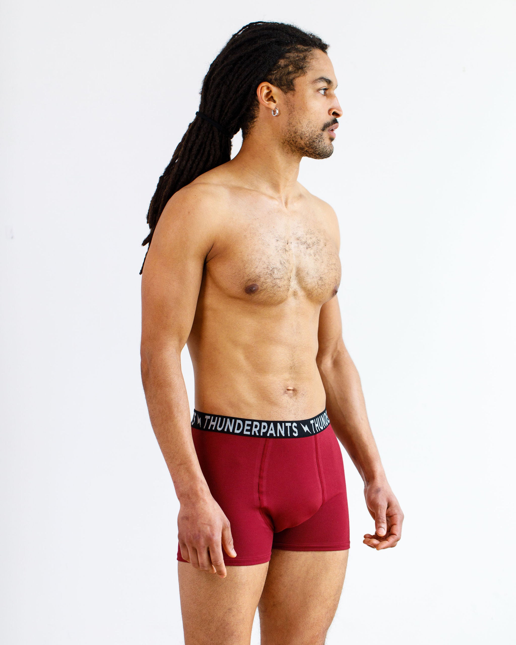 Model wearing Thunderpants Boxer Brief style underwear in Cabern-YAY - a deep wine red color.