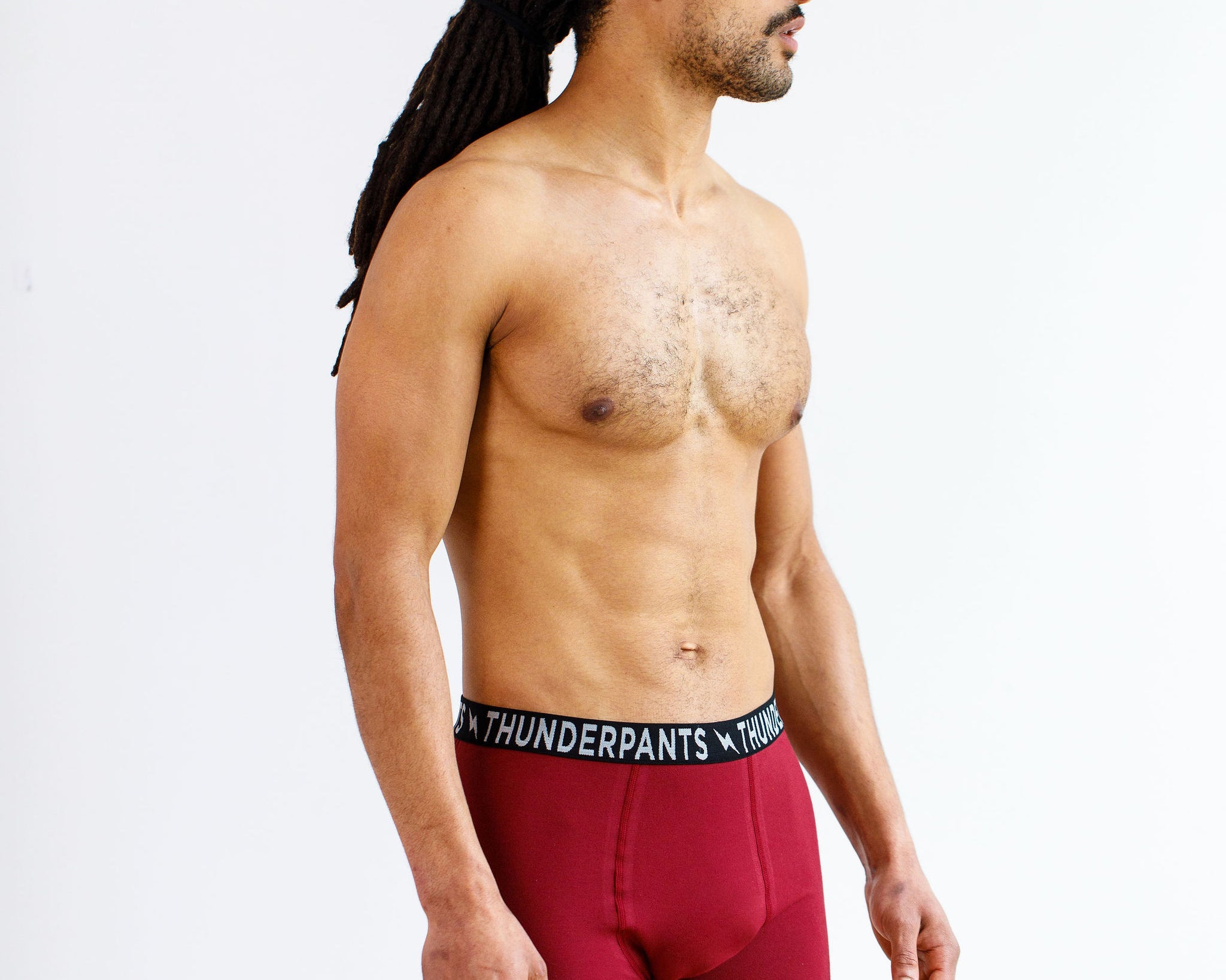 Model wearing Thunderpants Boxer Brief style underwear in Cabern-YAY - a deep wine red color.