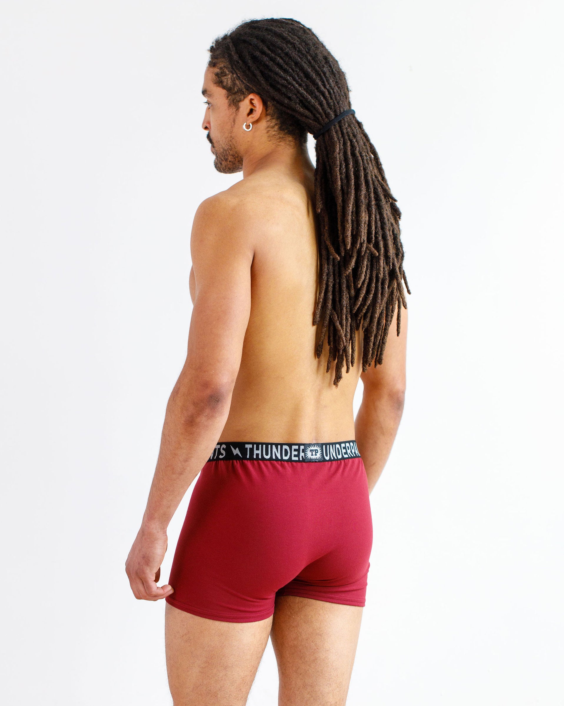 Model wearing Thunderpants Boxer Brief style underwear in Cabern-YAY - a deep wine red color.