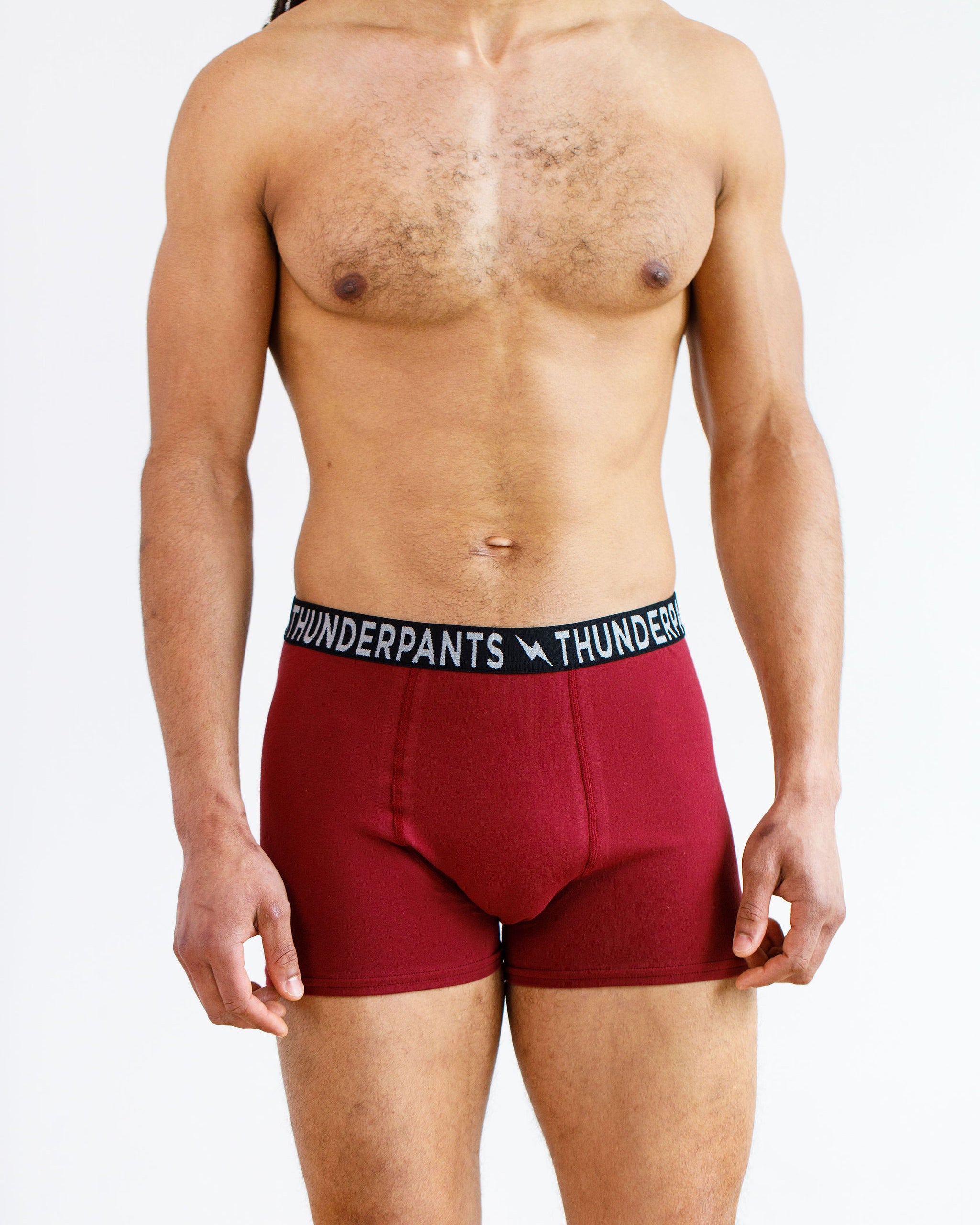 Model wearing Thunderpants Boxer Brief style underwear in Cabern-YAY - a deep wine red color.