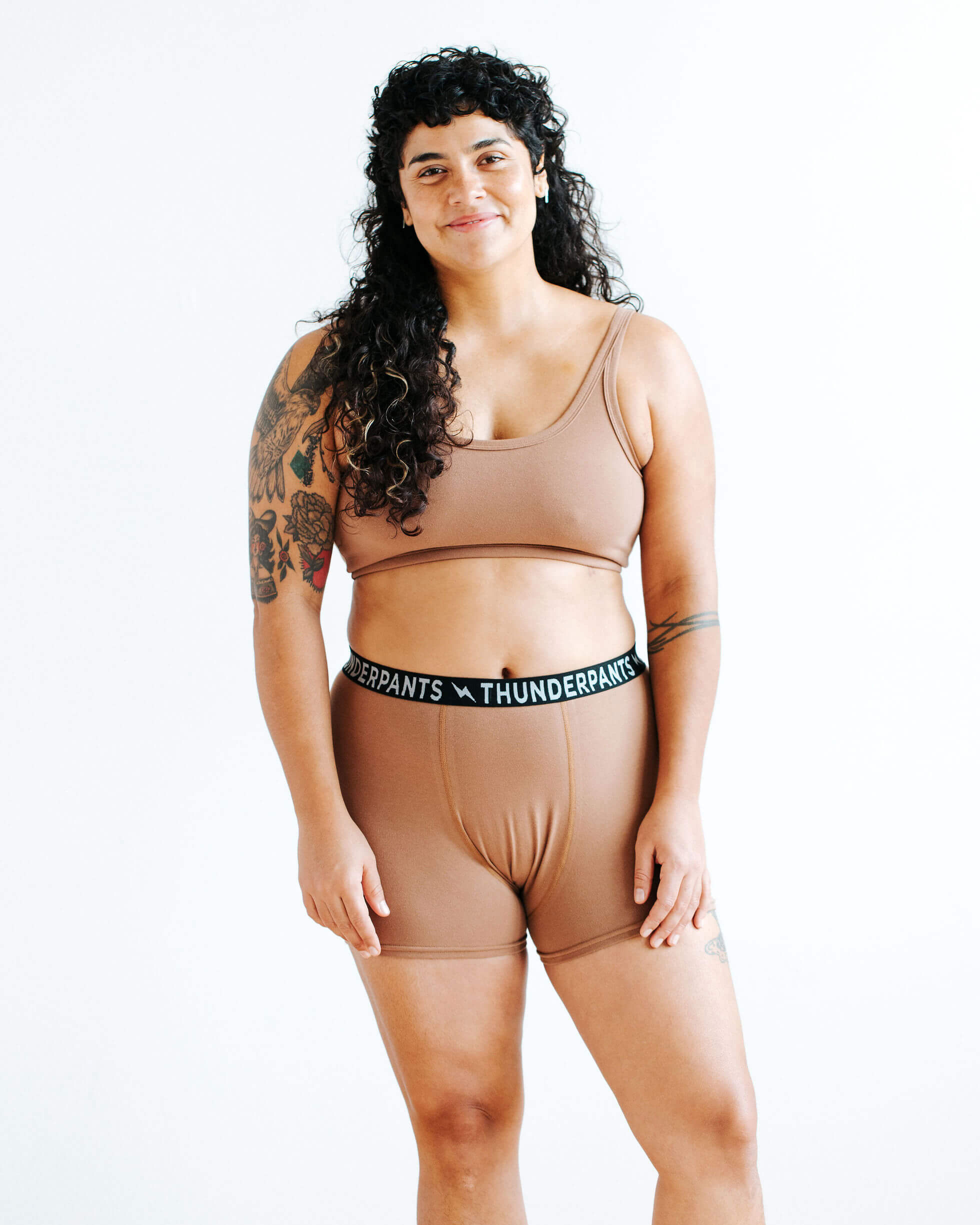 Model wearing Thunderpants Boxer Brief style underwear and Longline Bra in Hazelnut color.