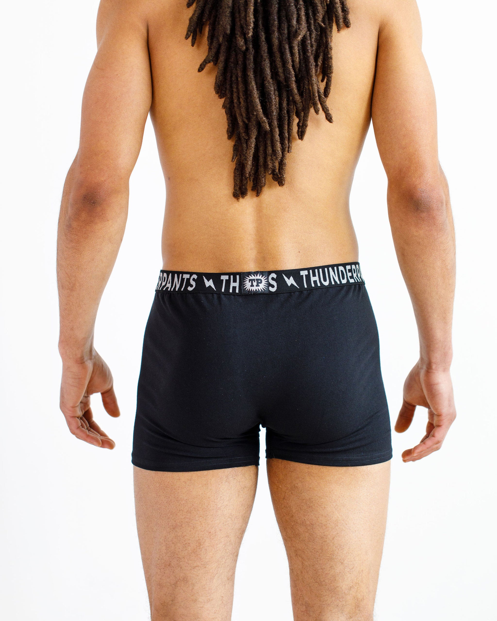 Male model wearing Thunderpants organic cotton Boxer Brief style underwear in Plain Black.