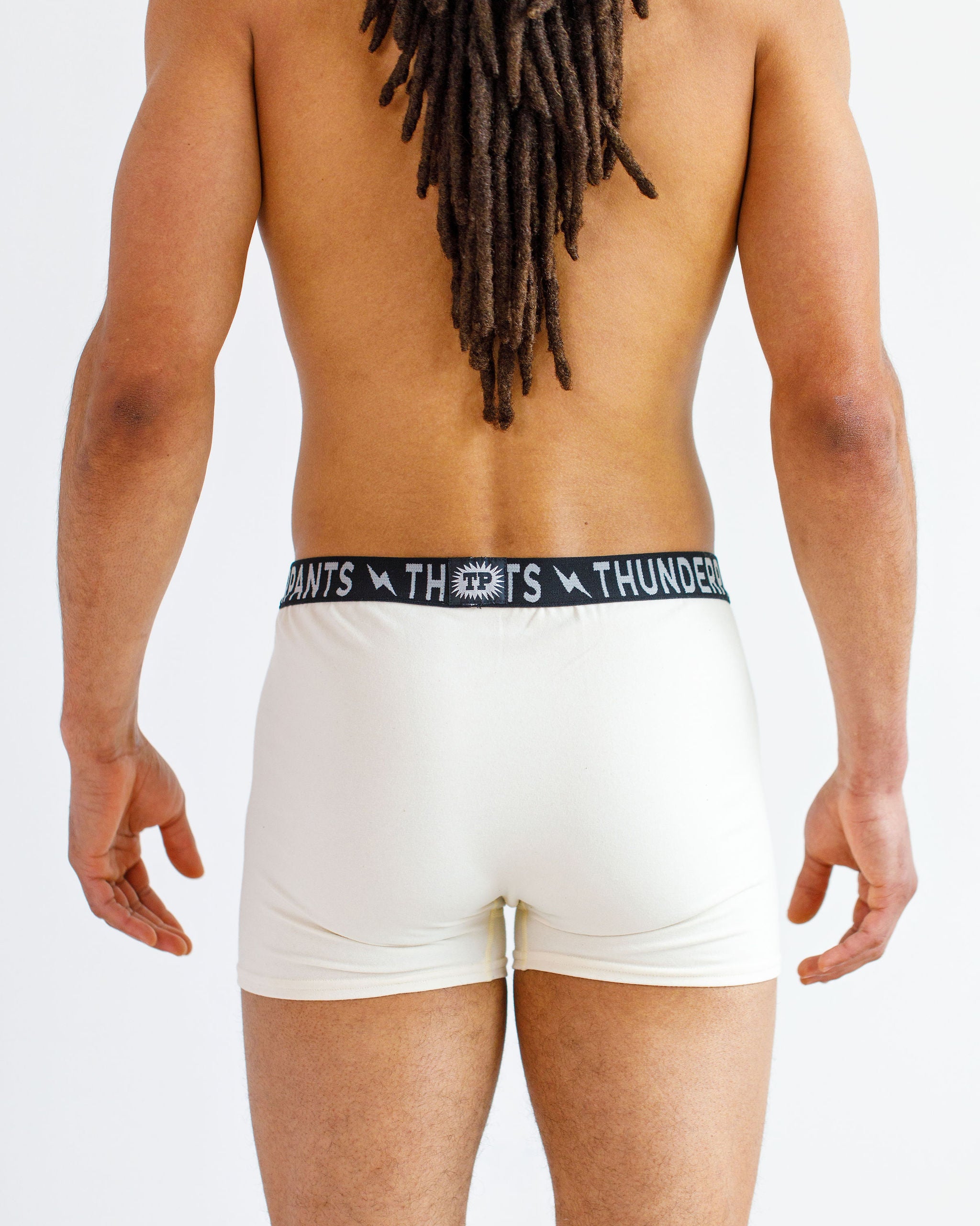 Male model wearing Thunderpants organic cotton Boxer Brief style underwear in Plain Vanilla.