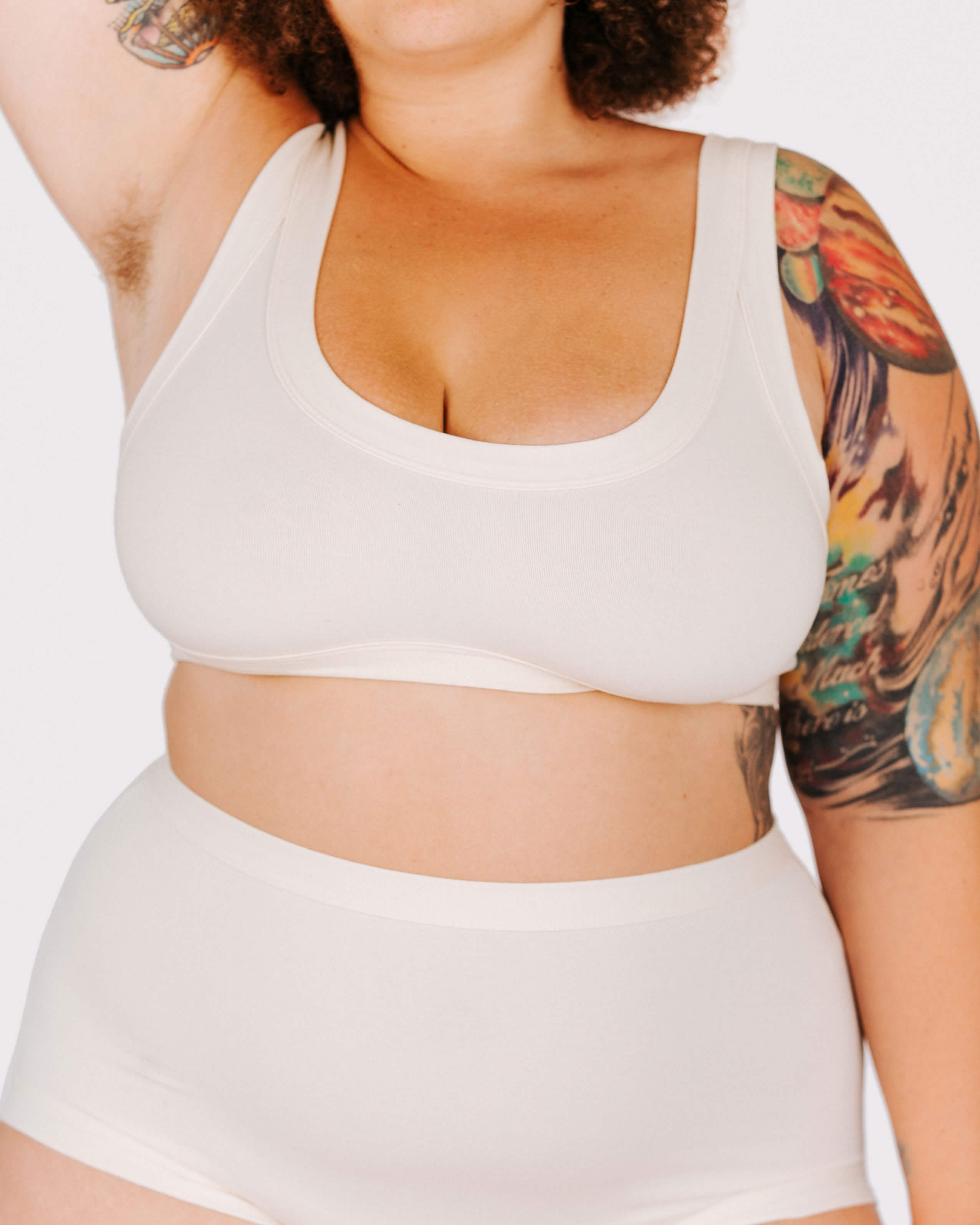 Close-up fit photo from the front of Thunderpants organic cotton Bralette in off-white on a model.