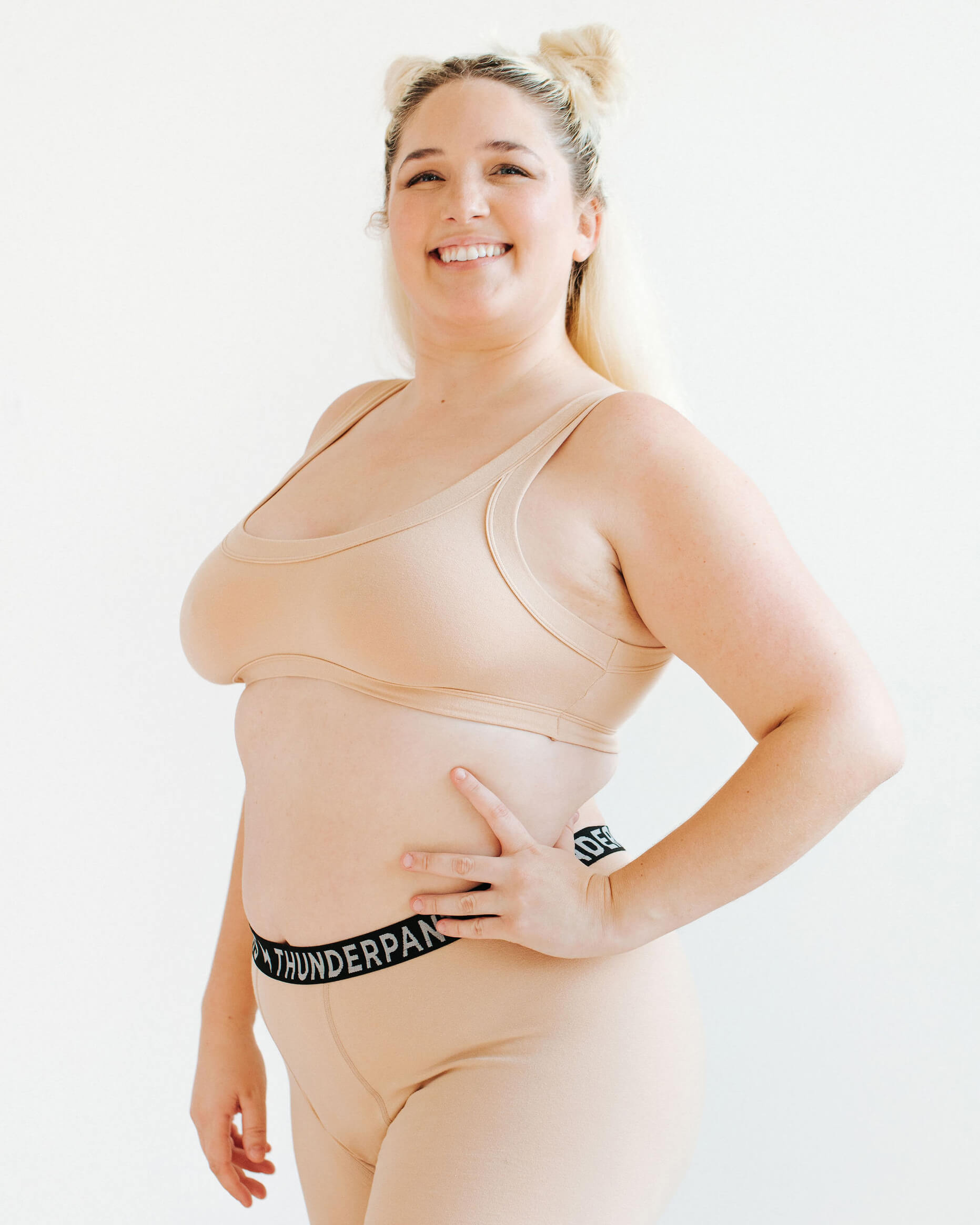 Model wearing Thunderpants Bralette and Boxer Brief in Pine Nut - lighter tan color.