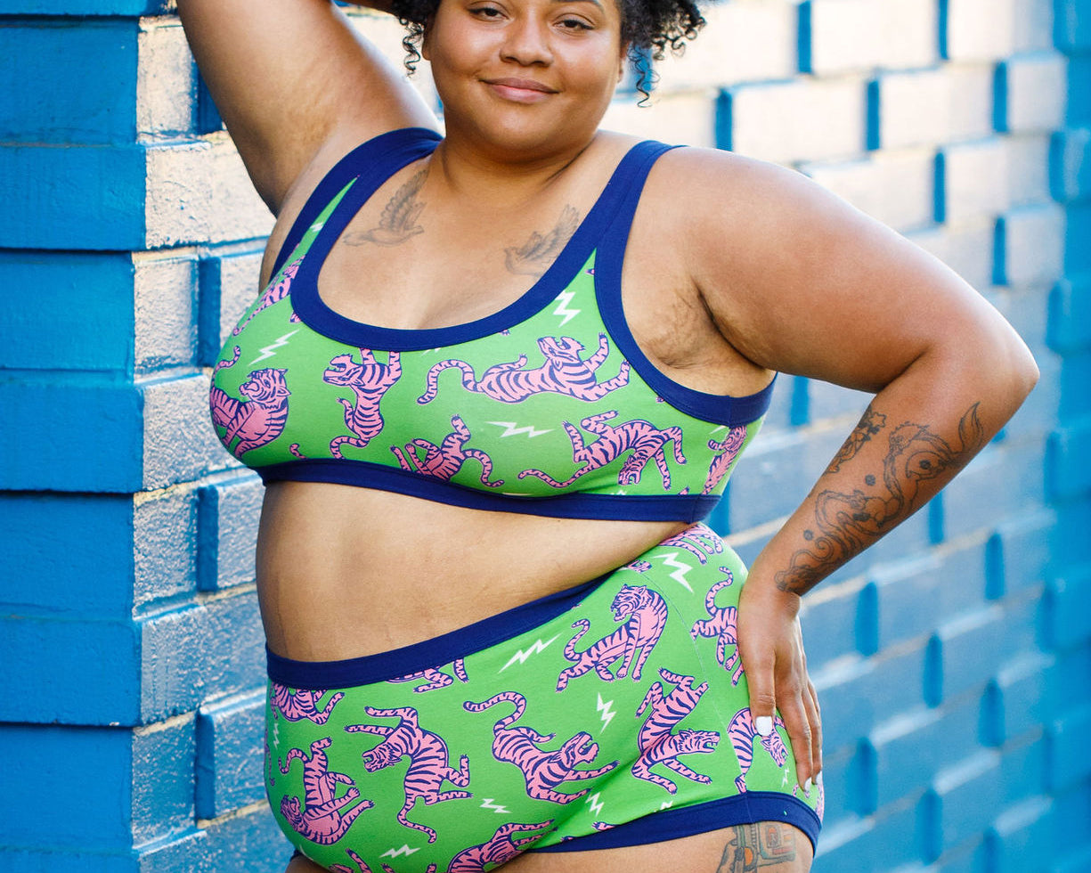 Drawing of Thunderpants organic cotton Bralette and Sky Rise style underwear in Electric Tiger - green with pink and blue tigers and white lightning bolts.