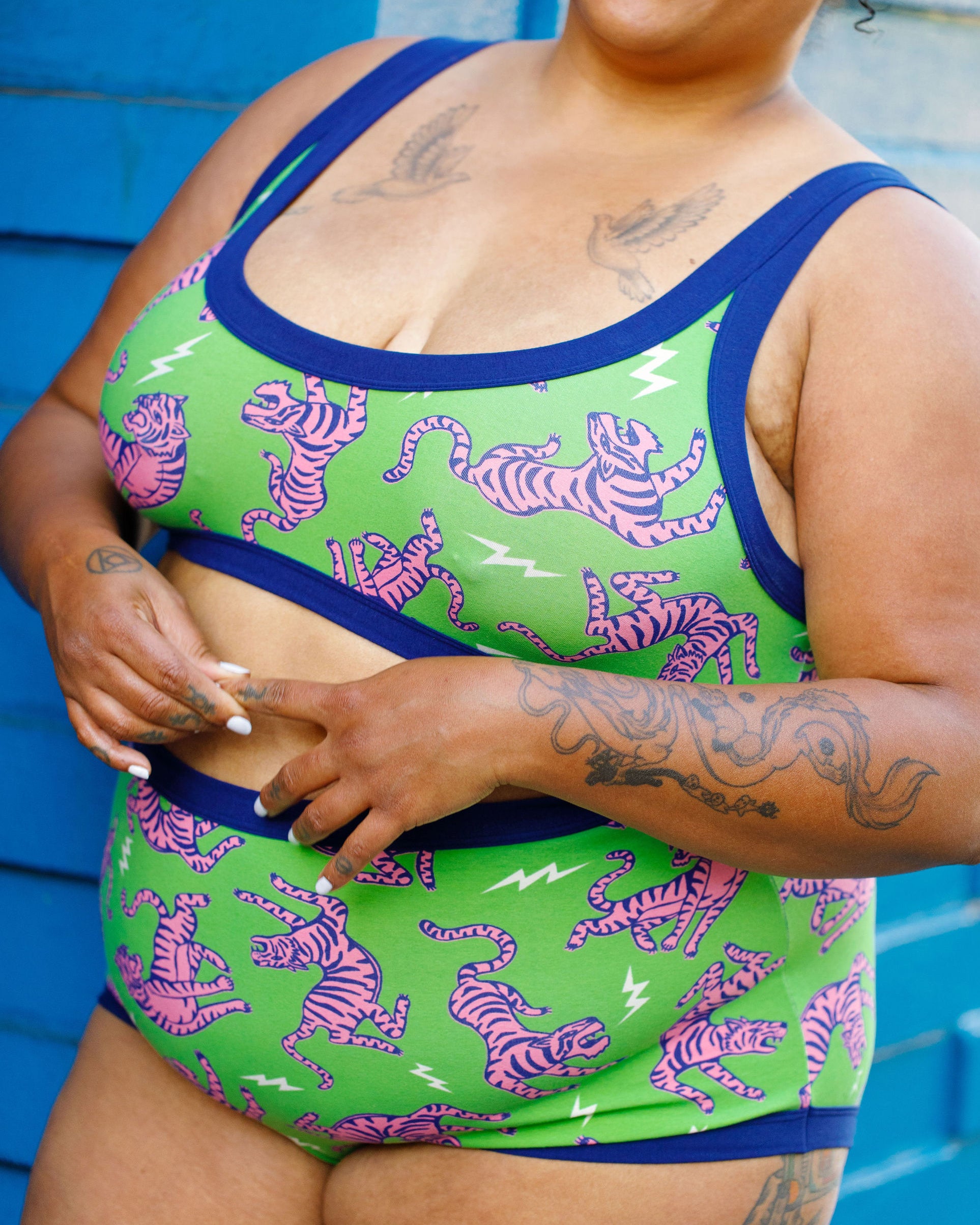 Drawing of Thunderpants organic cotton Bralette and Sky Rise style underwear in Electric Tiger - green with pink and blue tigers and white lightning bolts.