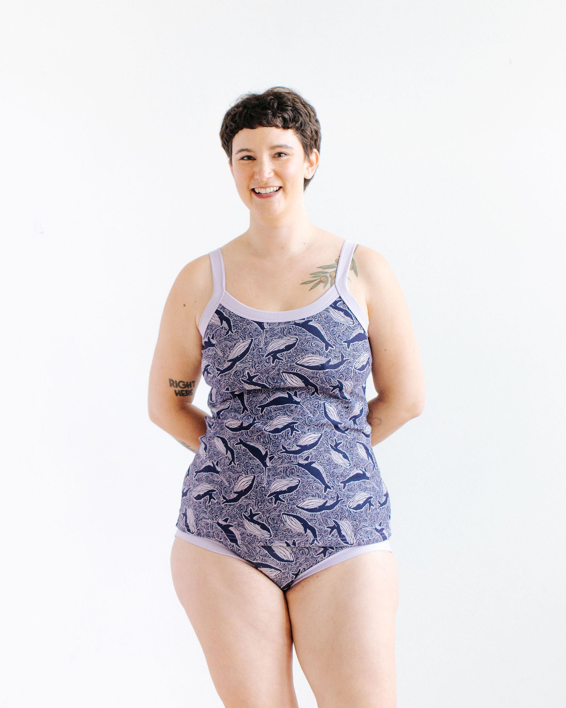 Model wearing Thunderpants Cami and Hipster style underwear in Whale, Whale, Whale print - indigo whales on lavender.