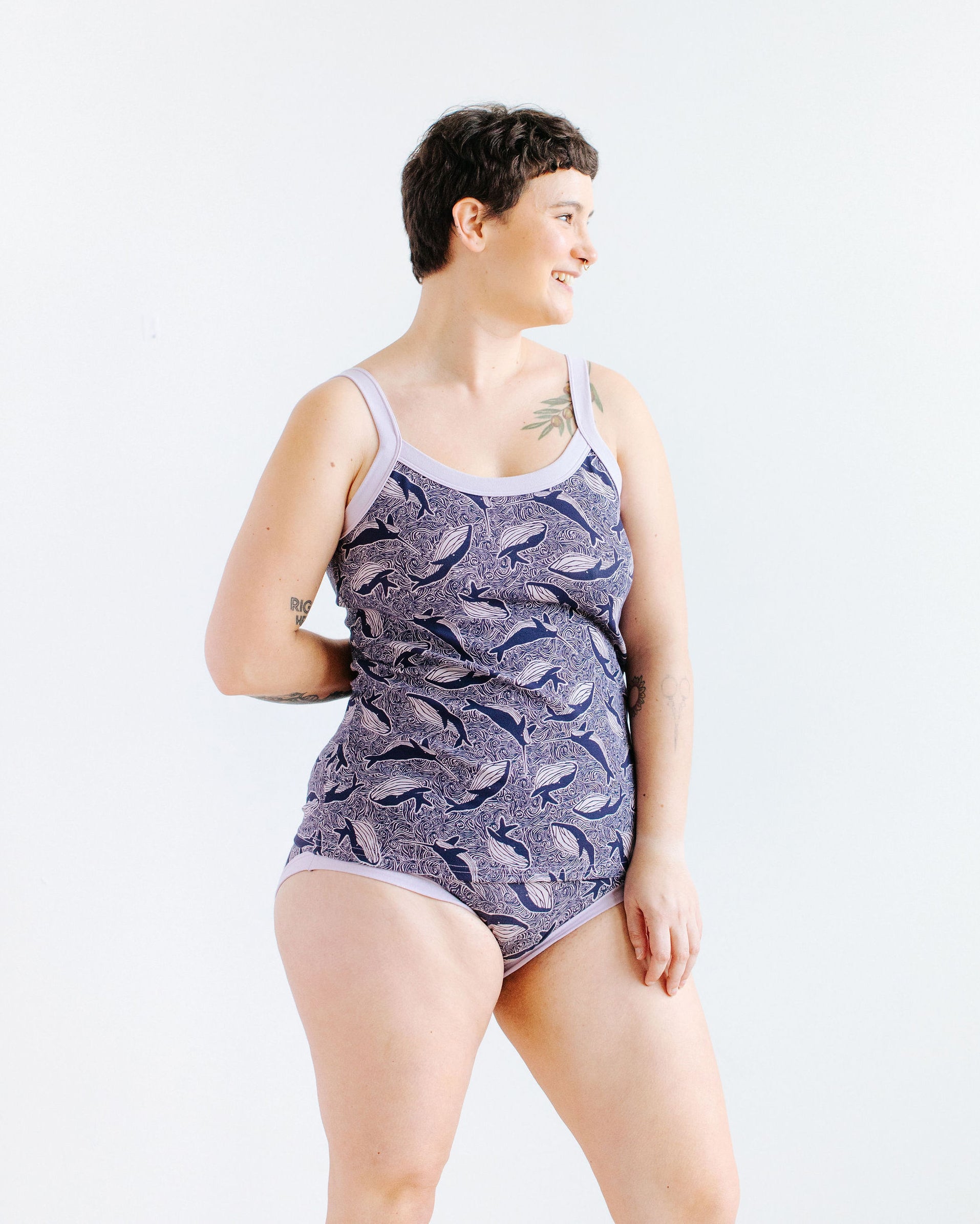 Model wearing Thunderpants Cami and Hipster style underwear in Whale, Whale, Whale print - indigo whales on lavender.
