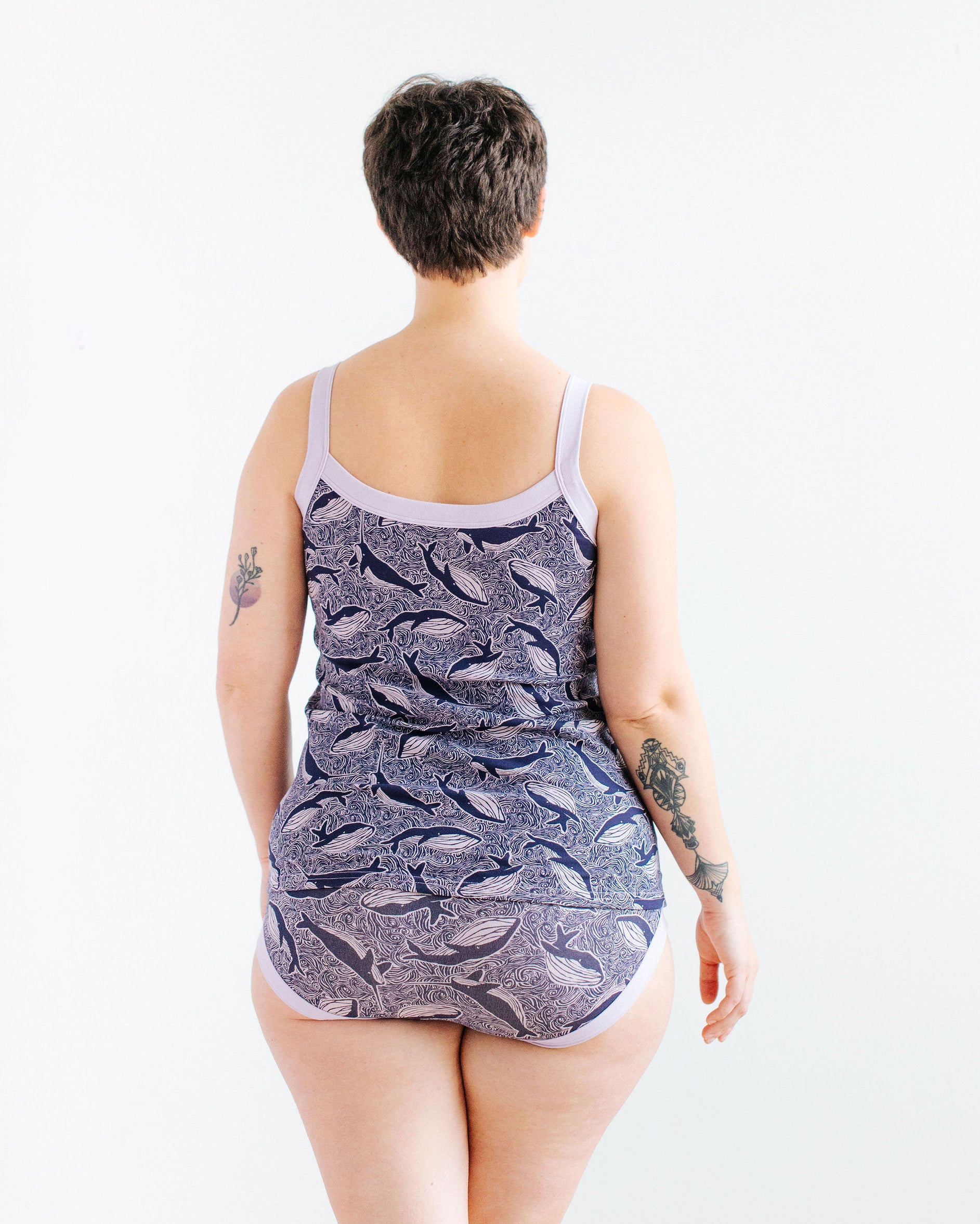 Model wearing Thunderpants Cami and Hipster style underwear in Whale, Whale, Whale print - indigo whales on lavender.